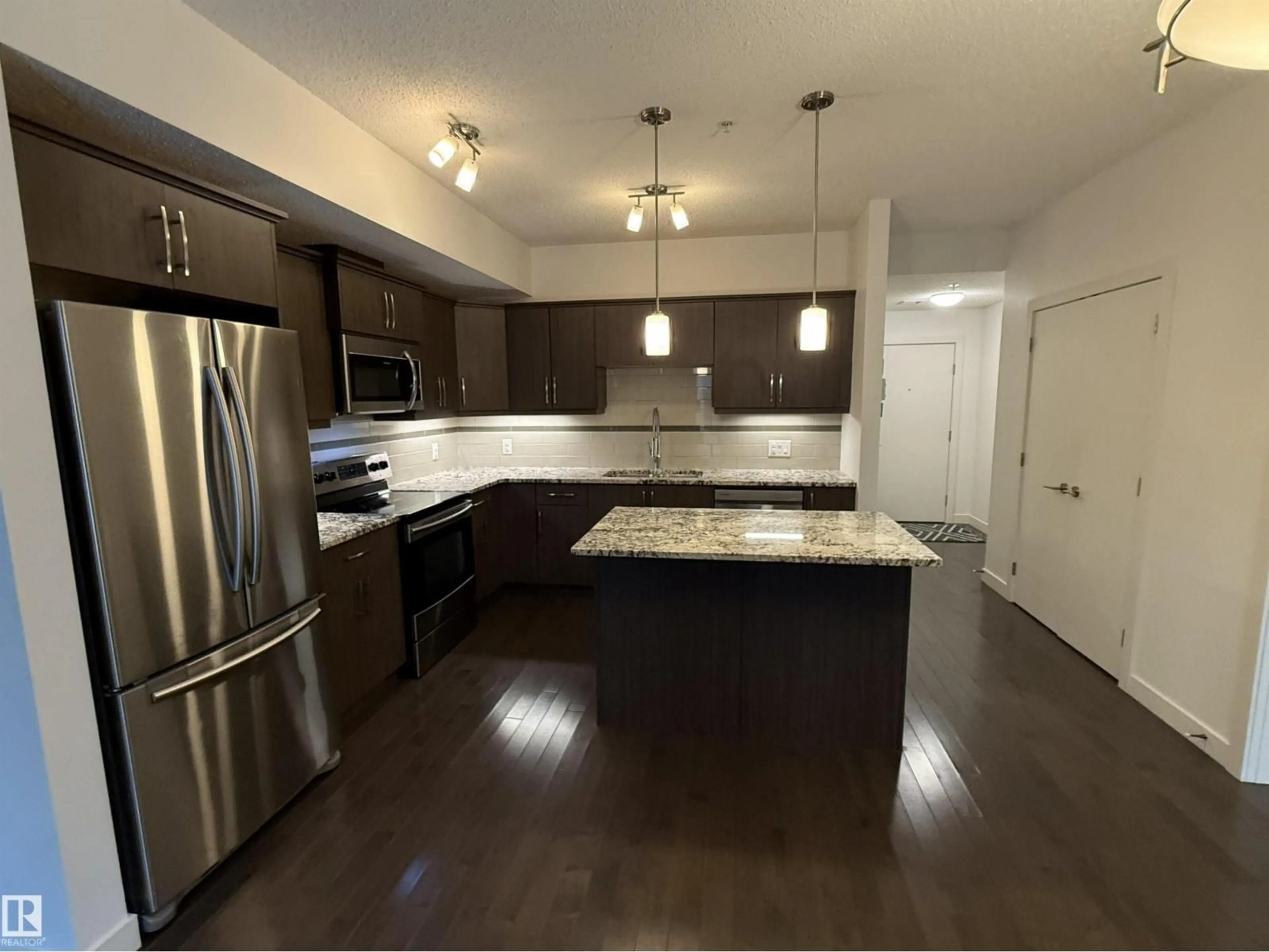 Open concept kitchen, unknown for #119 - 10523 123 ST, Edmonton Alberta T5N1N9