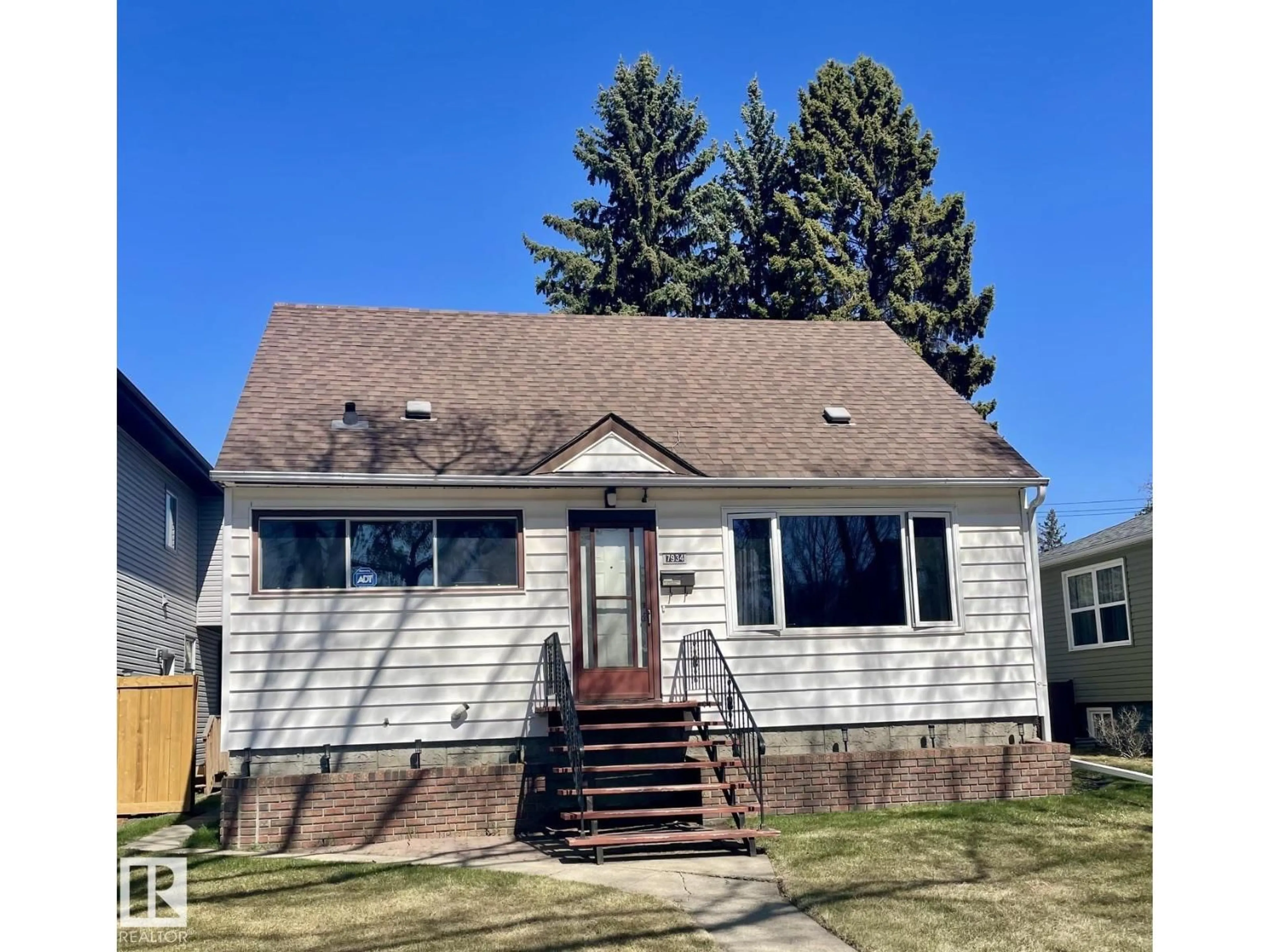Home with vinyl exterior material, street for 7934 81 AV, Edmonton Alberta T6C0V7