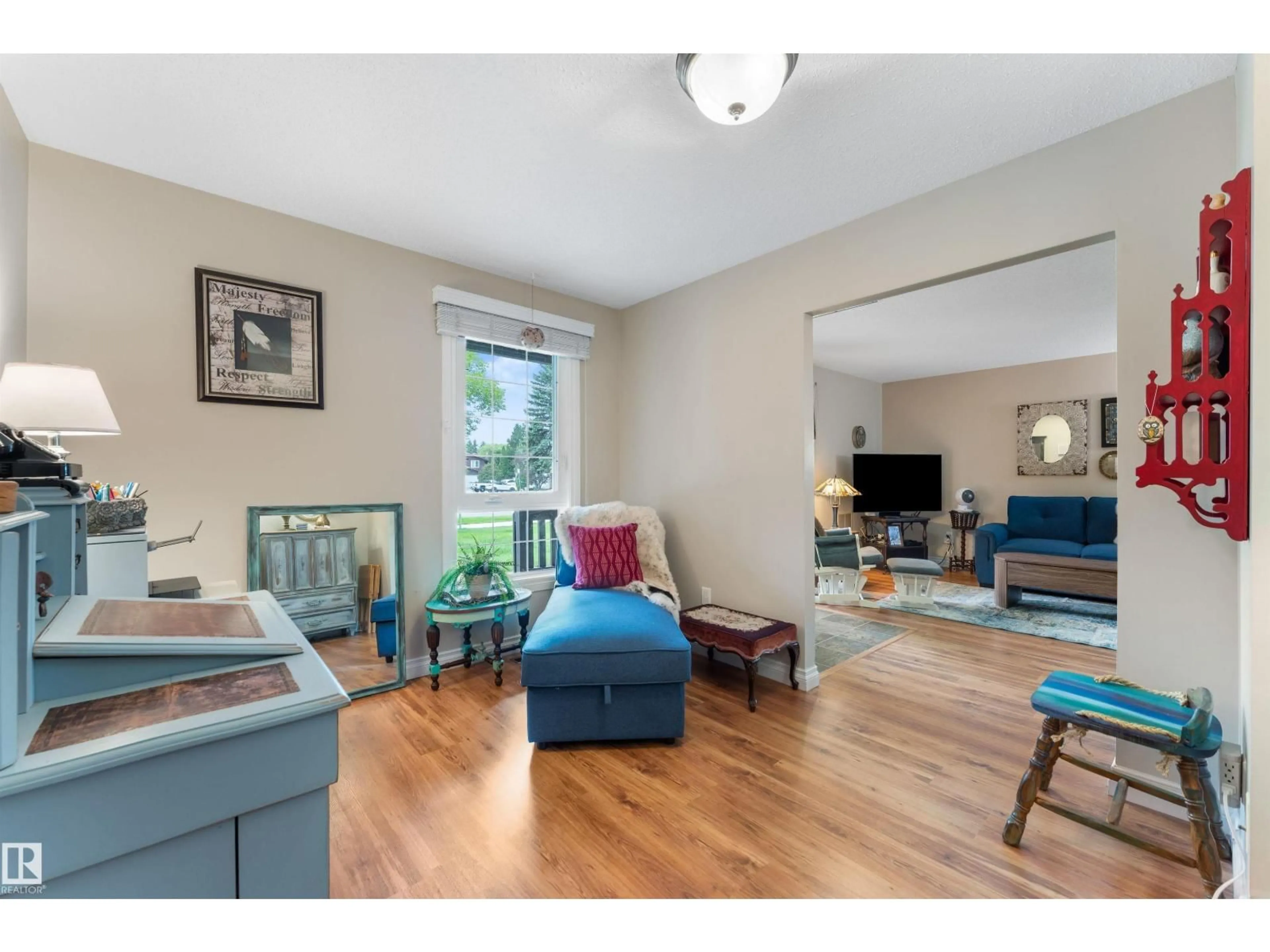 Living room with furniture, wood/laminate floor for NW - 5802 172 ST, Edmonton Alberta T6M1B4