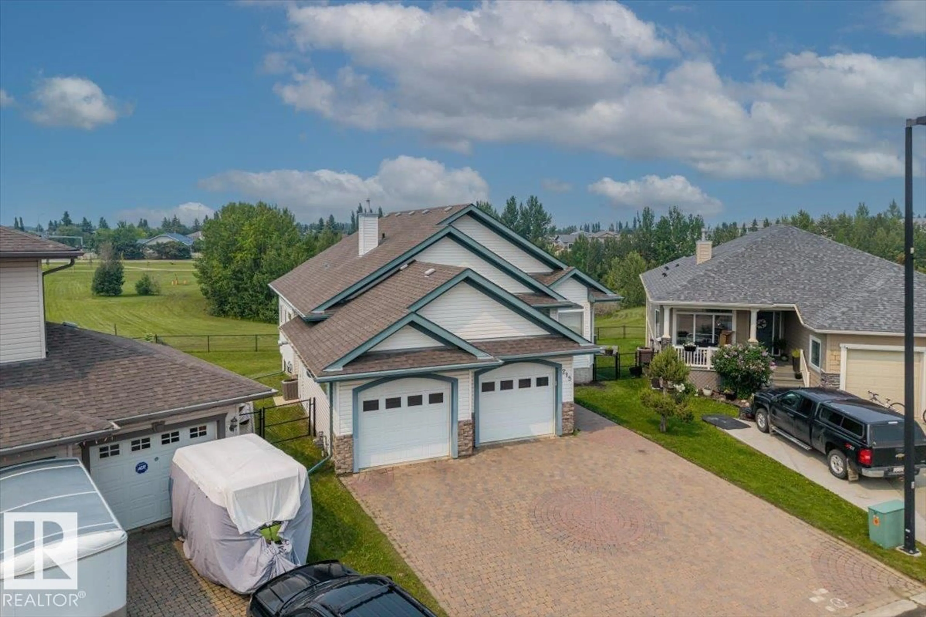 A pic from outside/outdoor area/front of a property/back of a property/a pic from drone, water/lake/river/ocean view for 215 WESTERRA, Stony Plain Alberta T7Z2W9