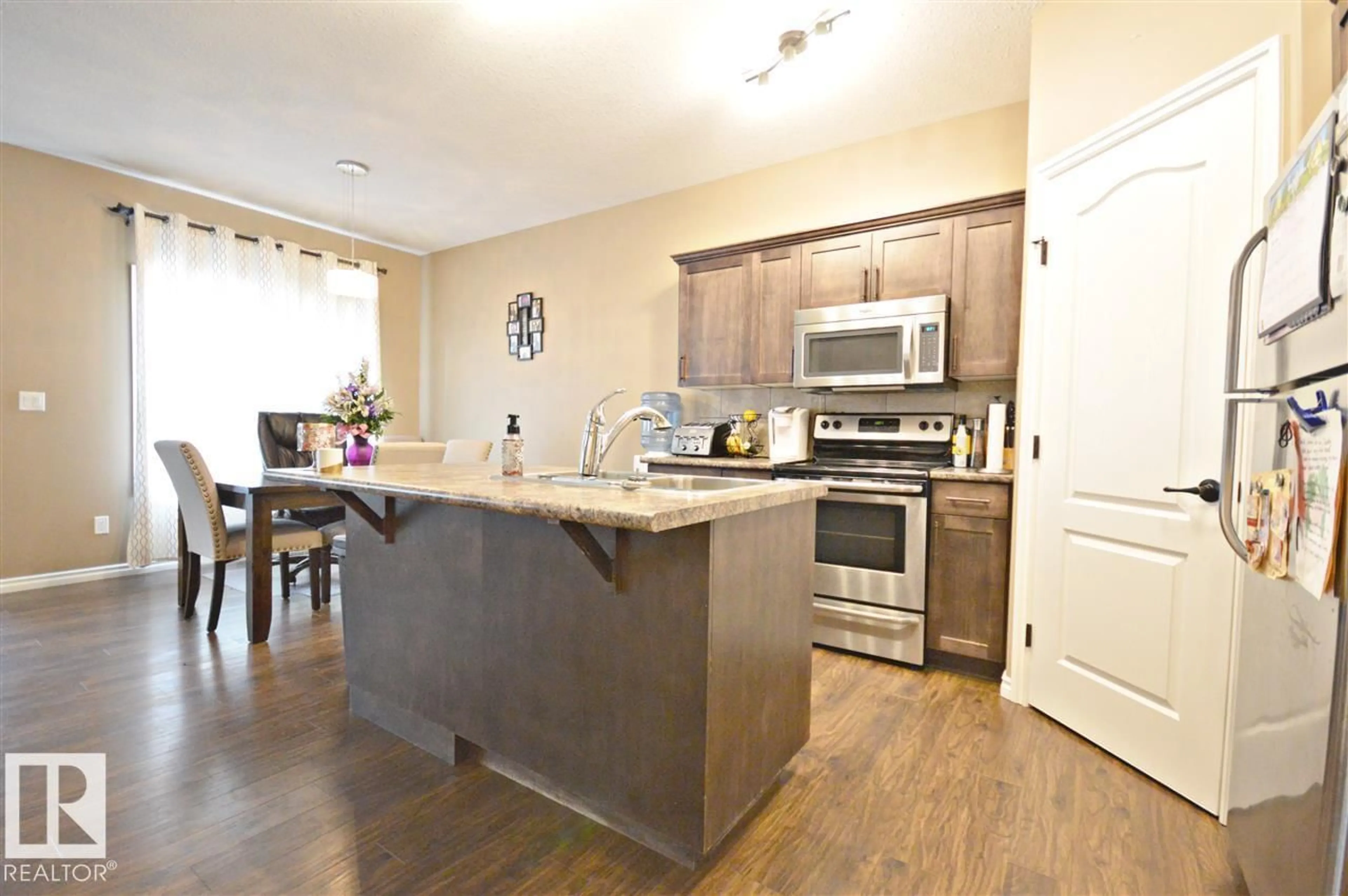 Open concept kitchen, wood/laminate floor for 3730 BEAU VISTA BV, Bonnyville Town Alberta T9N0A8