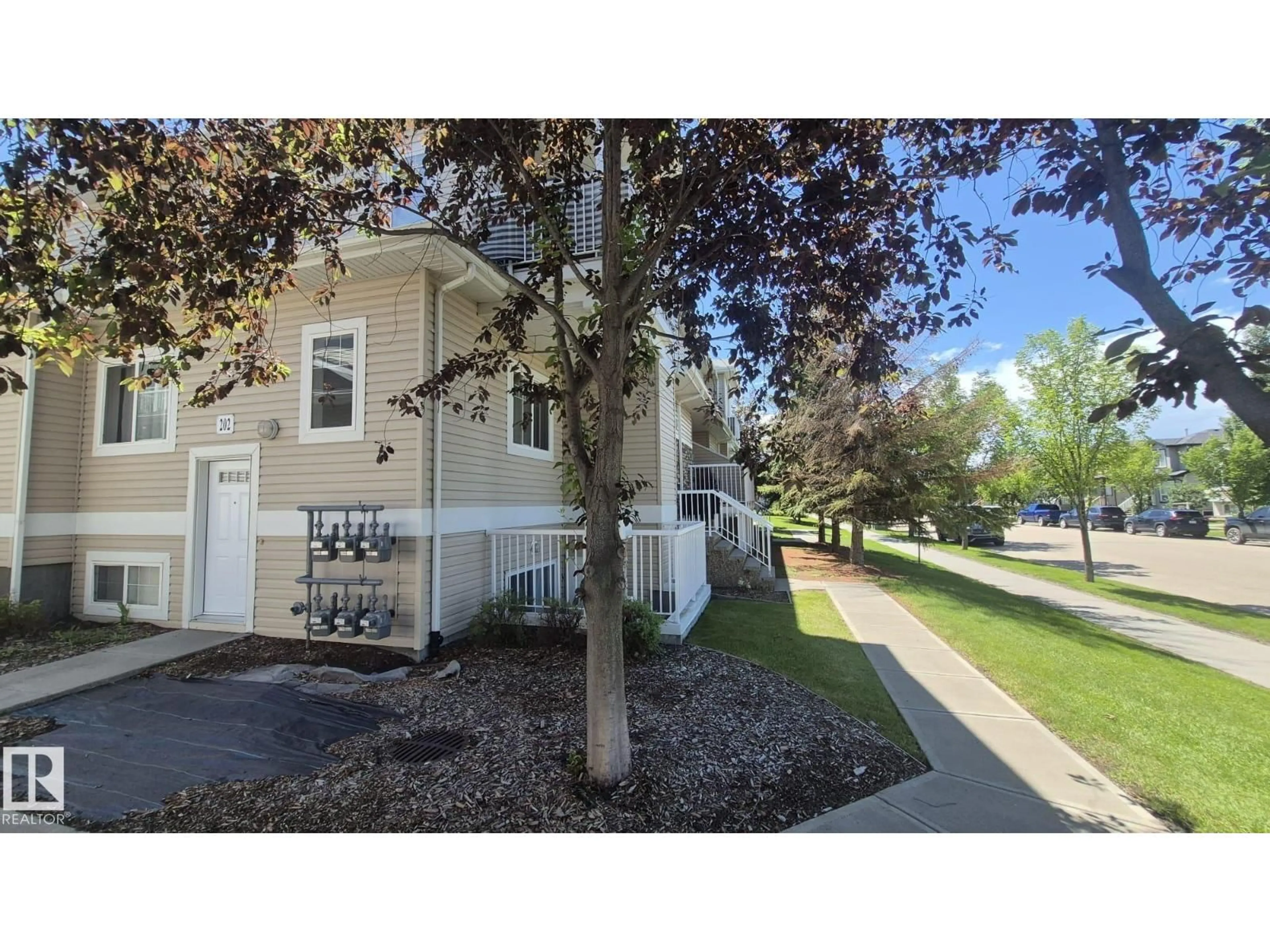 A pic from outside/outdoor area/front of a property/back of a property/a pic from drone, street for #202 - 164 BRIDGEPORT, Leduc Alberta T9E0L3