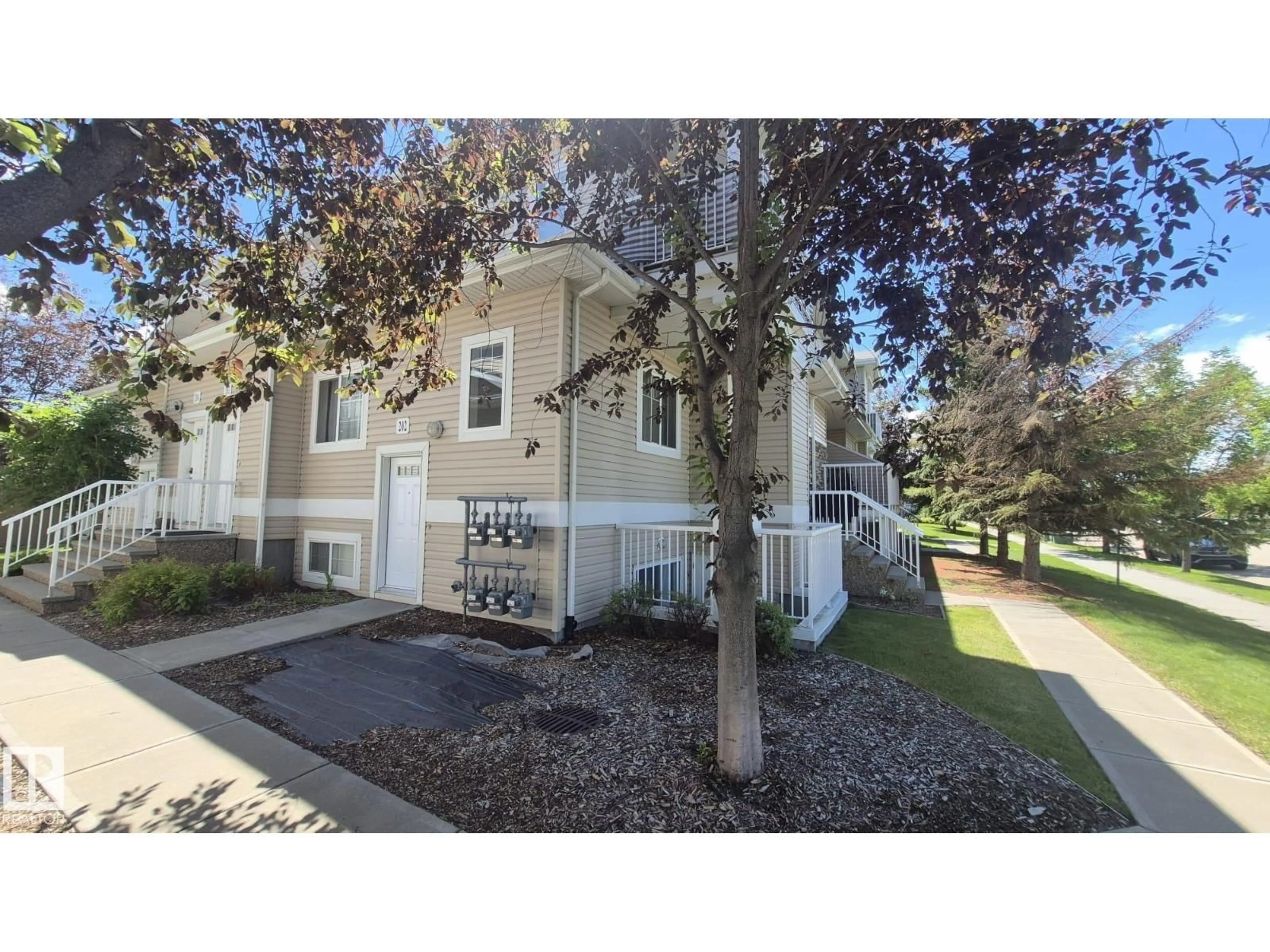A pic from outside/outdoor area/front of a property/back of a property/a pic from drone, street for #202 - 164 BRIDGEPORT, Leduc Alberta T9E0L3