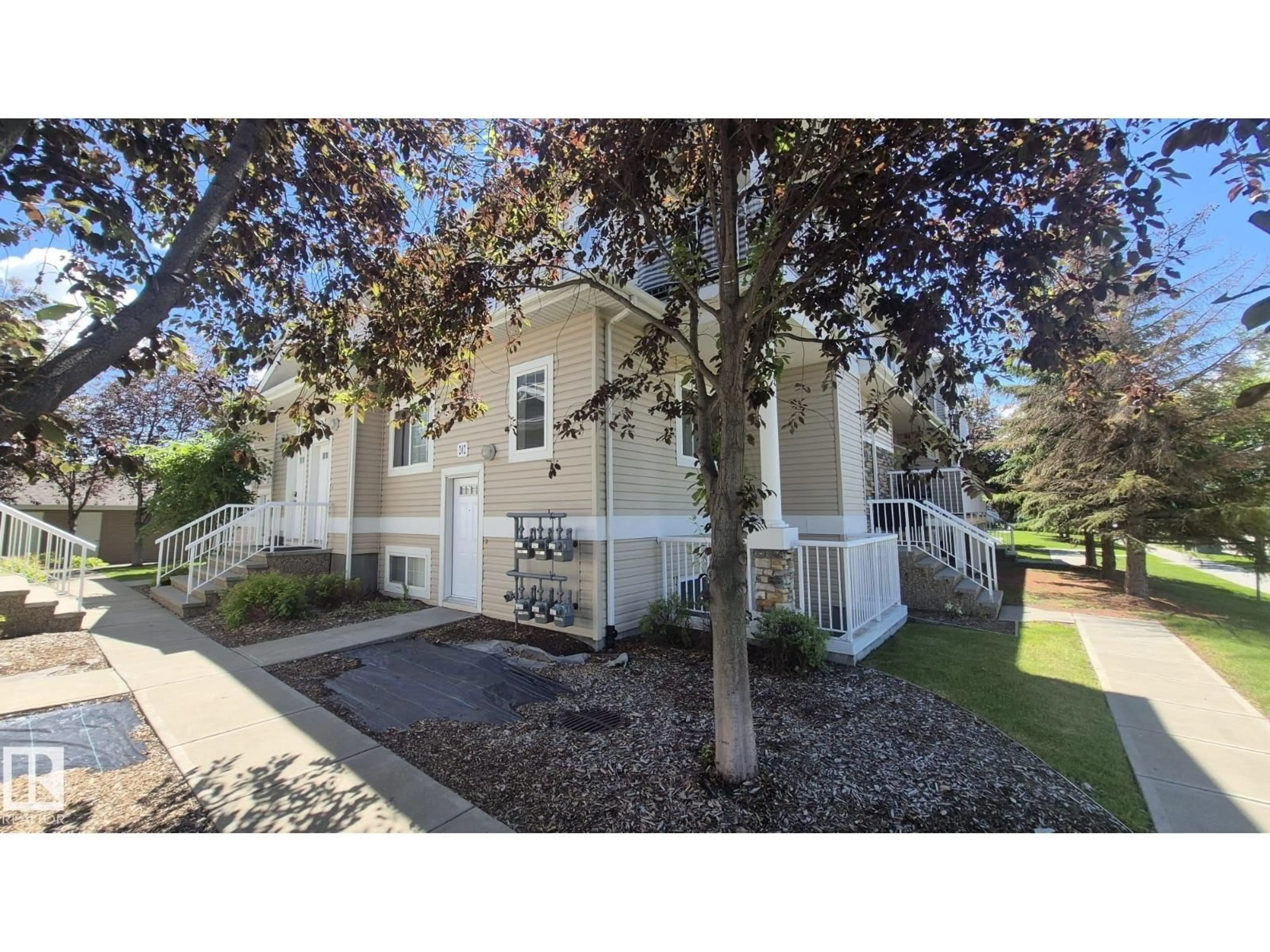 A pic from outside/outdoor area/front of a property/back of a property/a pic from drone, street for #202 - 164 BRIDGEPORT, Leduc Alberta T9E0L3