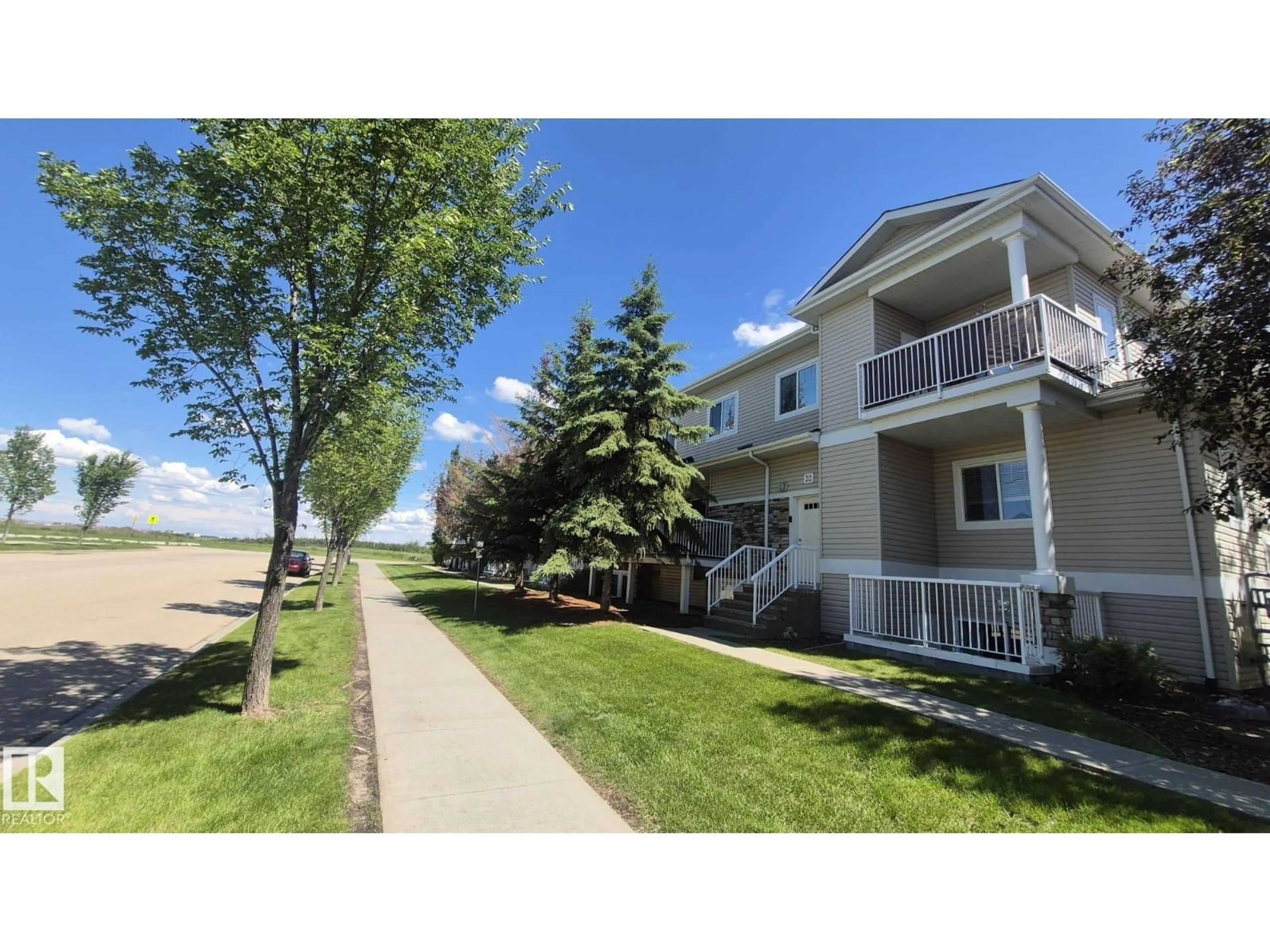 A pic from outside/outdoor area/front of a property/back of a property/a pic from drone, water/lake/river/ocean view for #202 - 164 BRIDGEPORT, Leduc Alberta T9E0L3