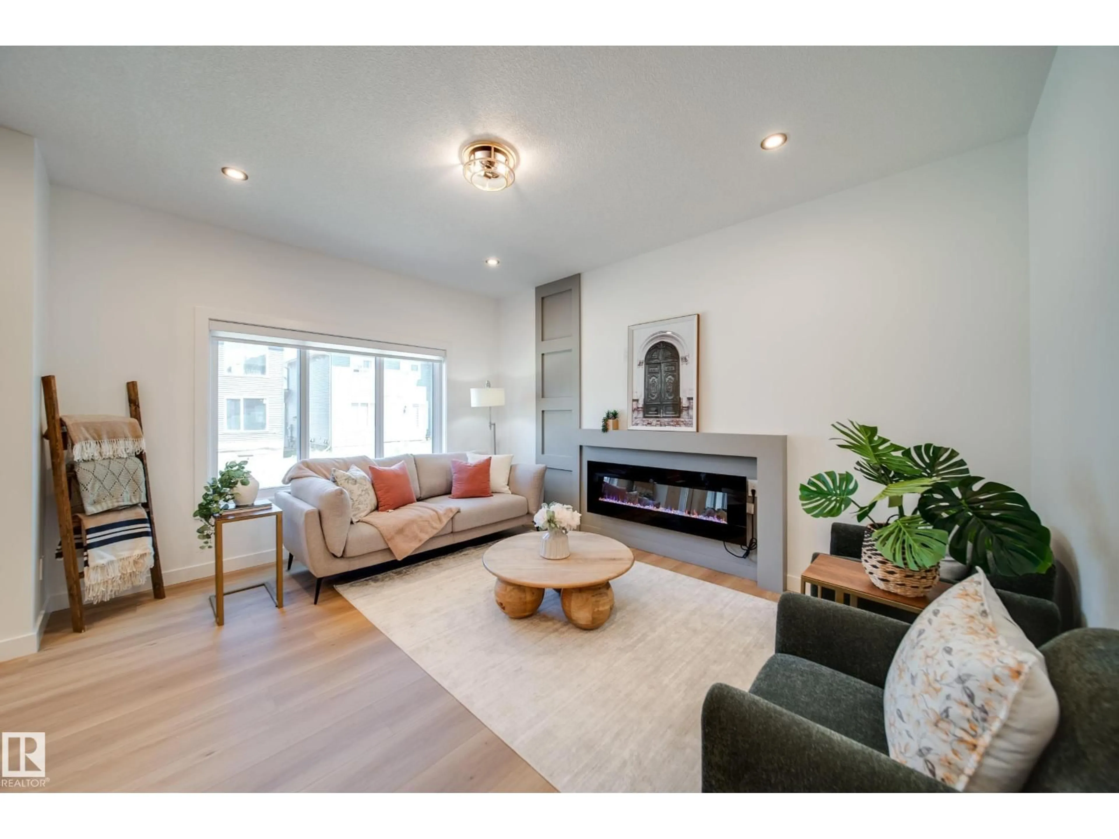 Living room with furniture, wood/laminate floor for 6 BLACKBIRD BN, Fort Saskatchewan Alberta T8L0G6