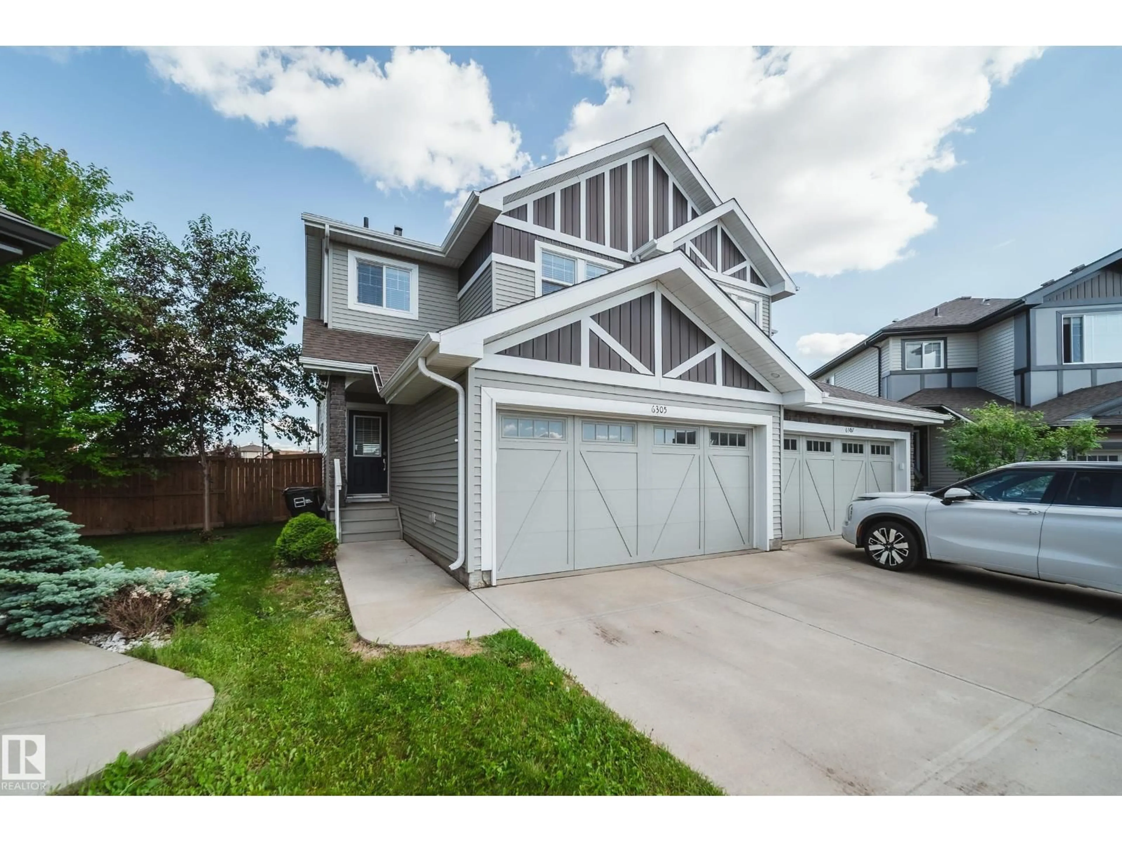 Home with vinyl exterior material, street for 6305 167A AV, Edmonton Alberta T5Y3P7