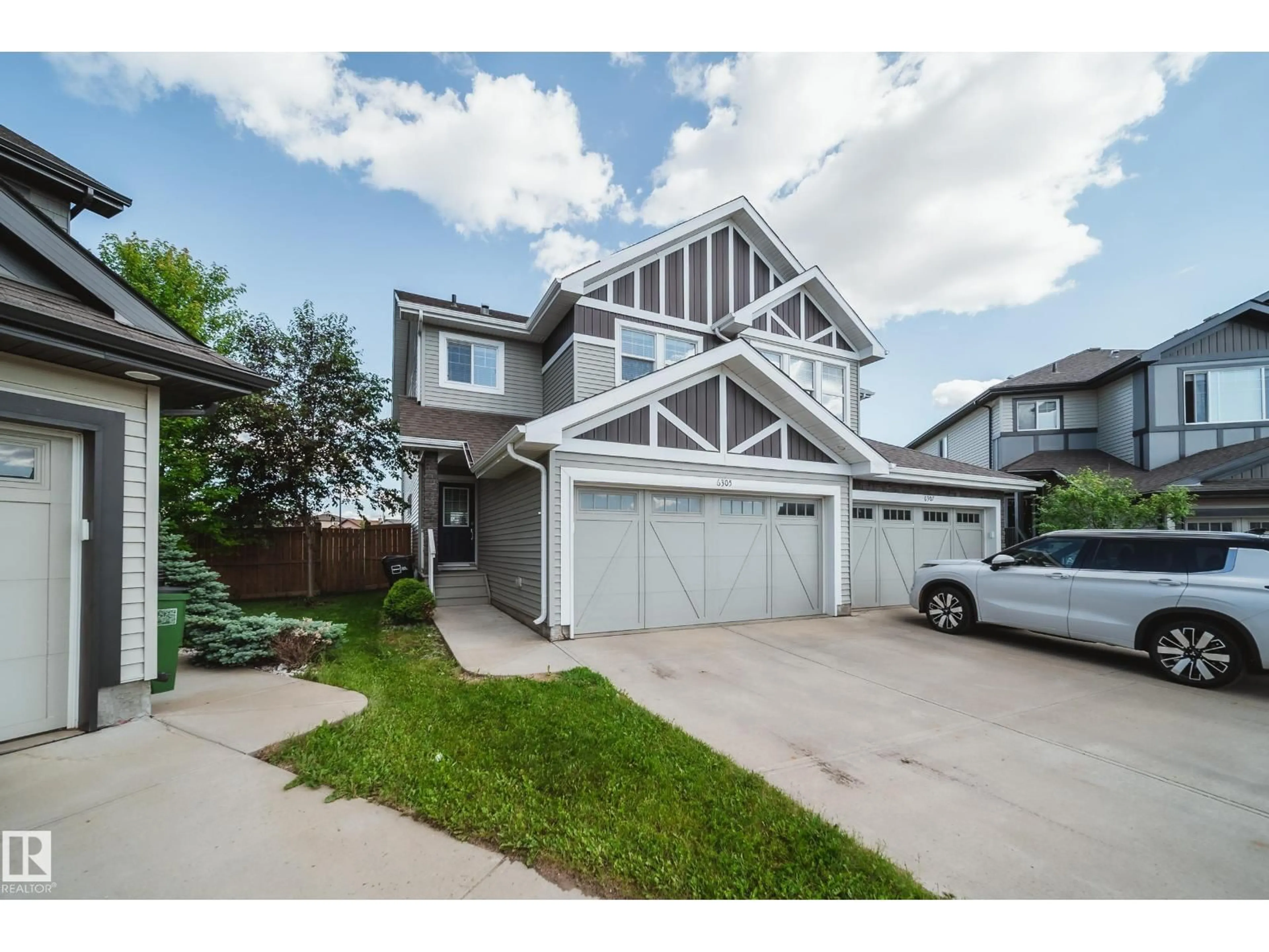 Home with vinyl exterior material, street for 6305 167A AV, Edmonton Alberta T5Y3P7