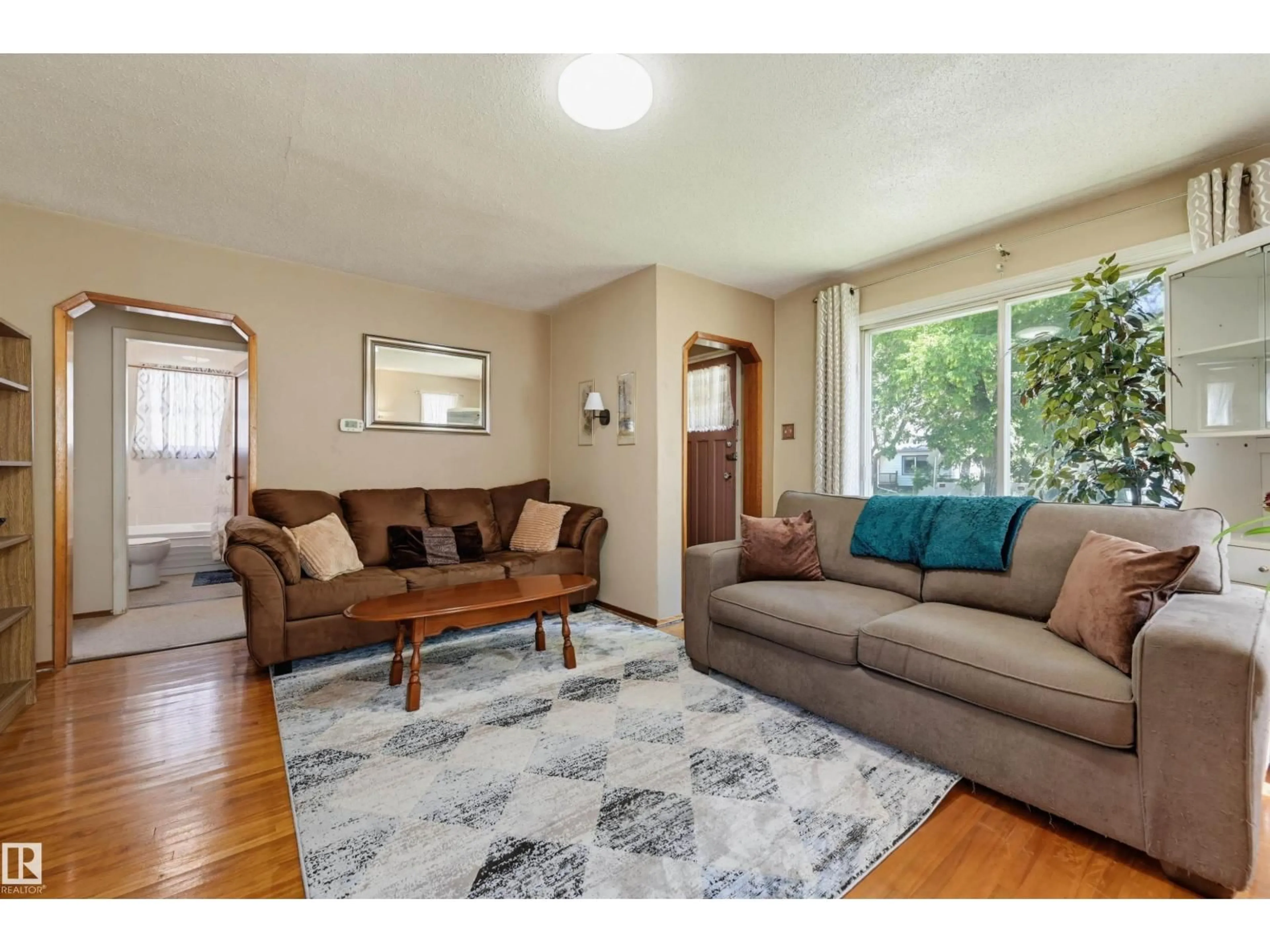 Living room with furniture, unknown for NW - 11414 88 ST, Edmonton Alberta T5B3R1