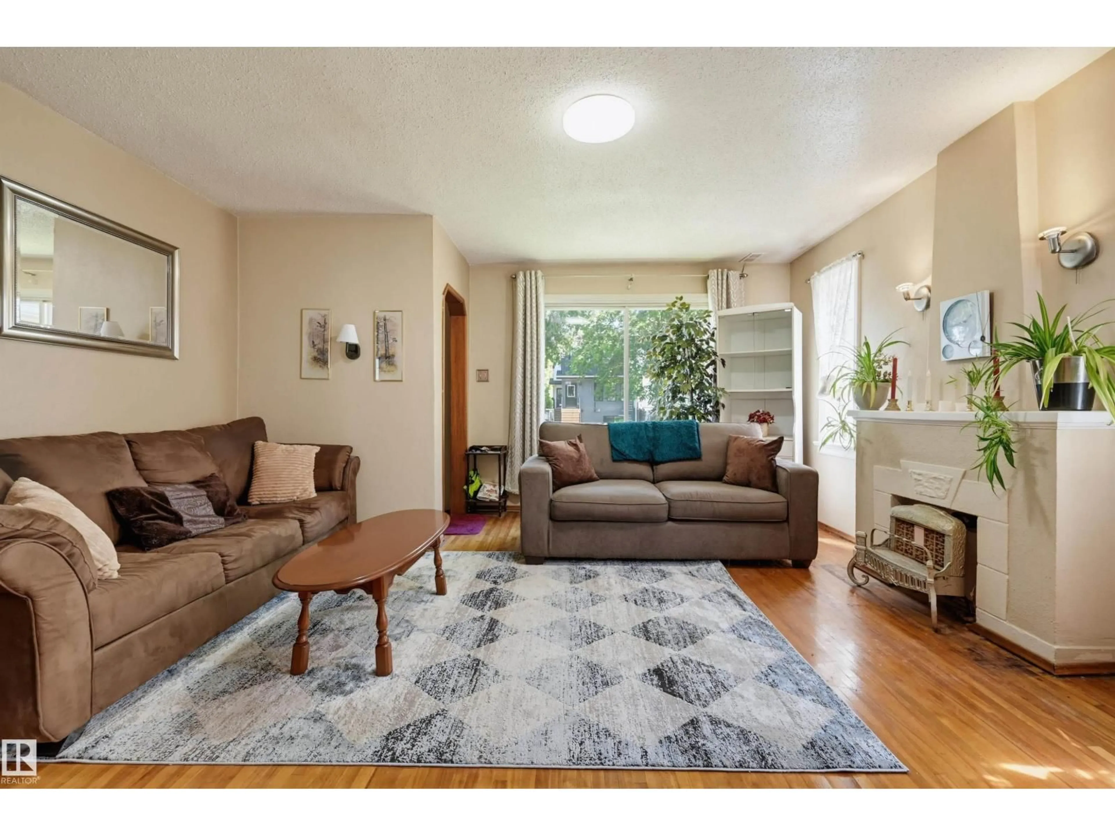 Living room with furniture, unknown for NW - 11414 88 ST, Edmonton Alberta T5B3R1