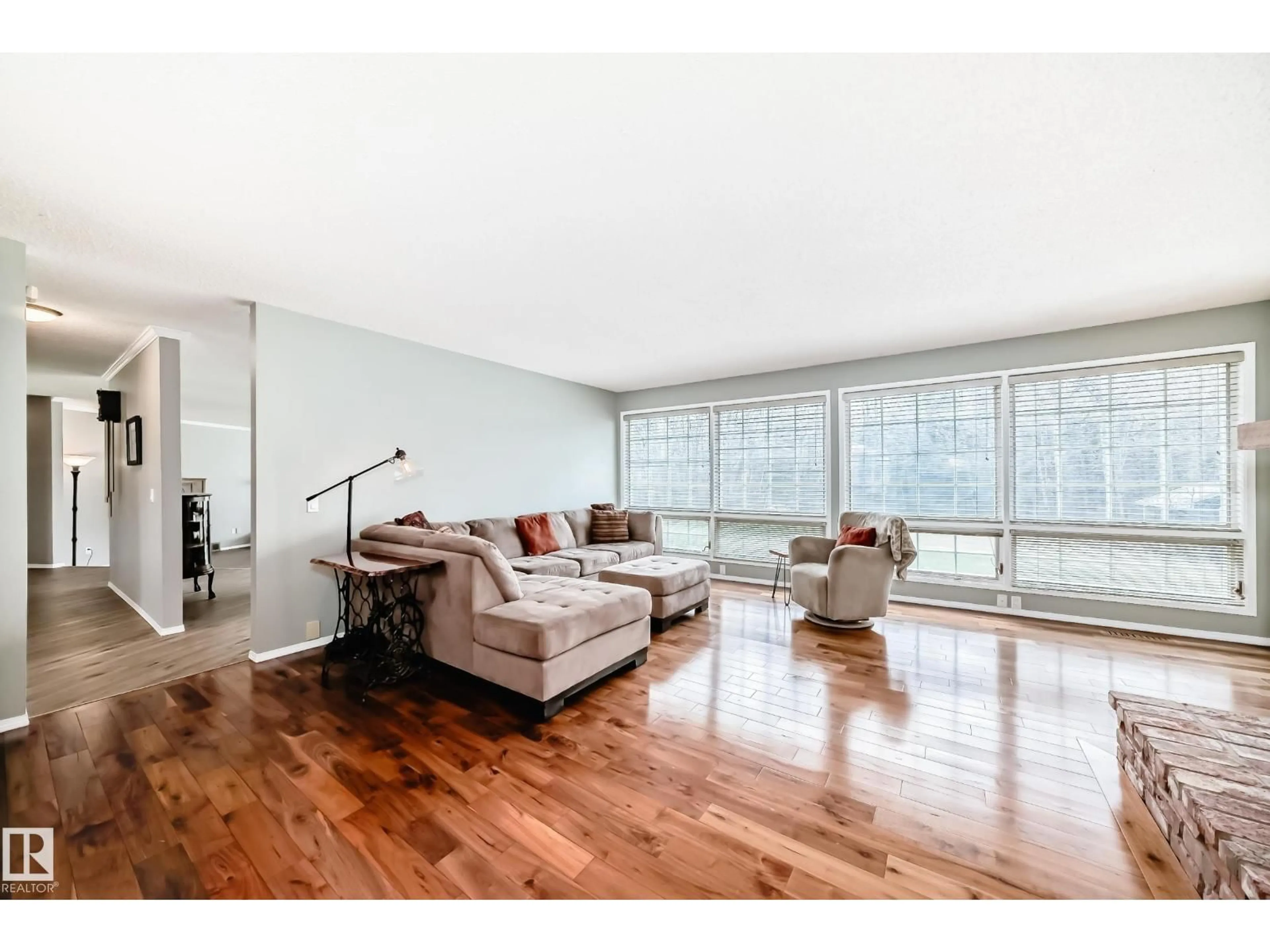 Living room with furniture, wood/laminate floor for 52131 - 73 RGE ROAD 210, Rural Strathcona County Alberta T8A1G2