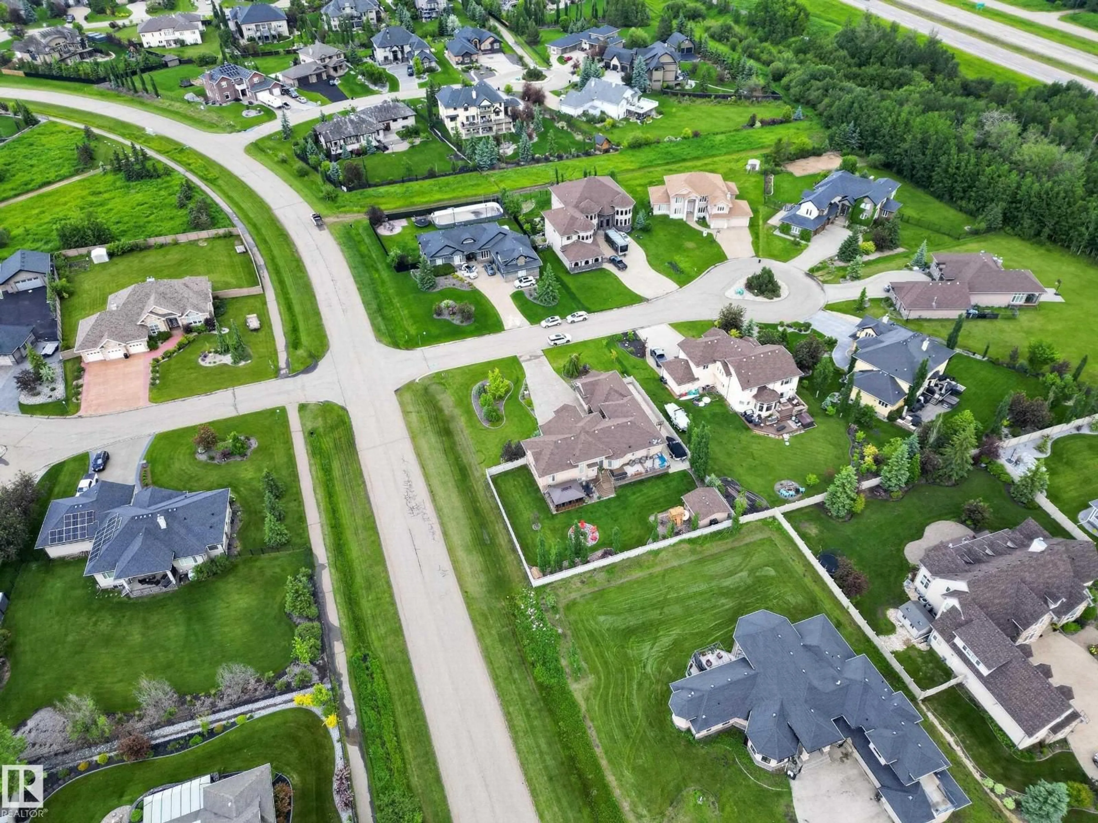A pic from outside/outdoor area/front of a property/back of a property/a pic from drone, street for #405 - 23033 WYE RD, Rural Strathcona County Alberta T8B1H9