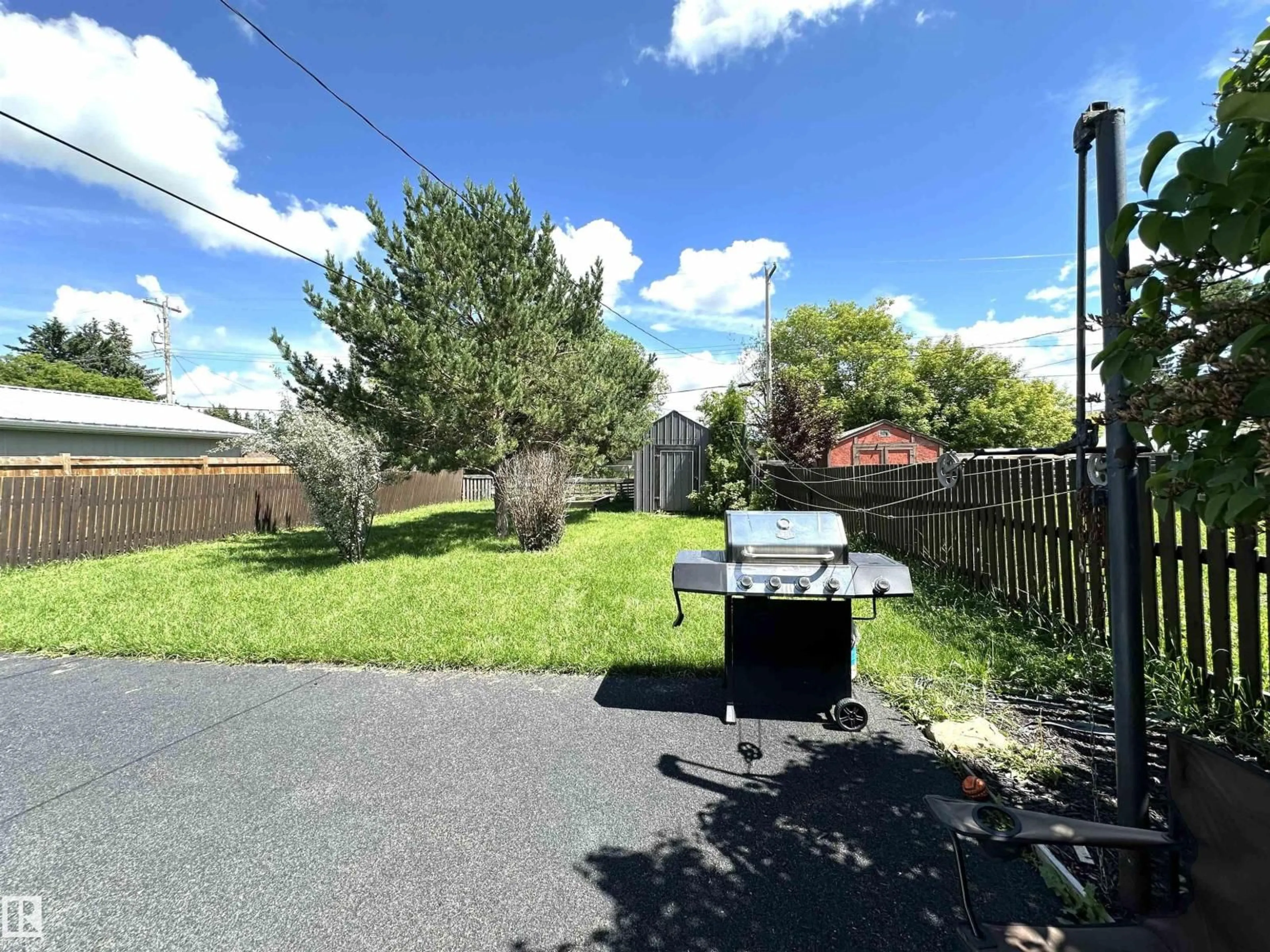 A pic from outside/outdoor area/front of a property/back of a property/a pic from drone, street for 825 2 ST, Thorhild Alberta T0A3J0