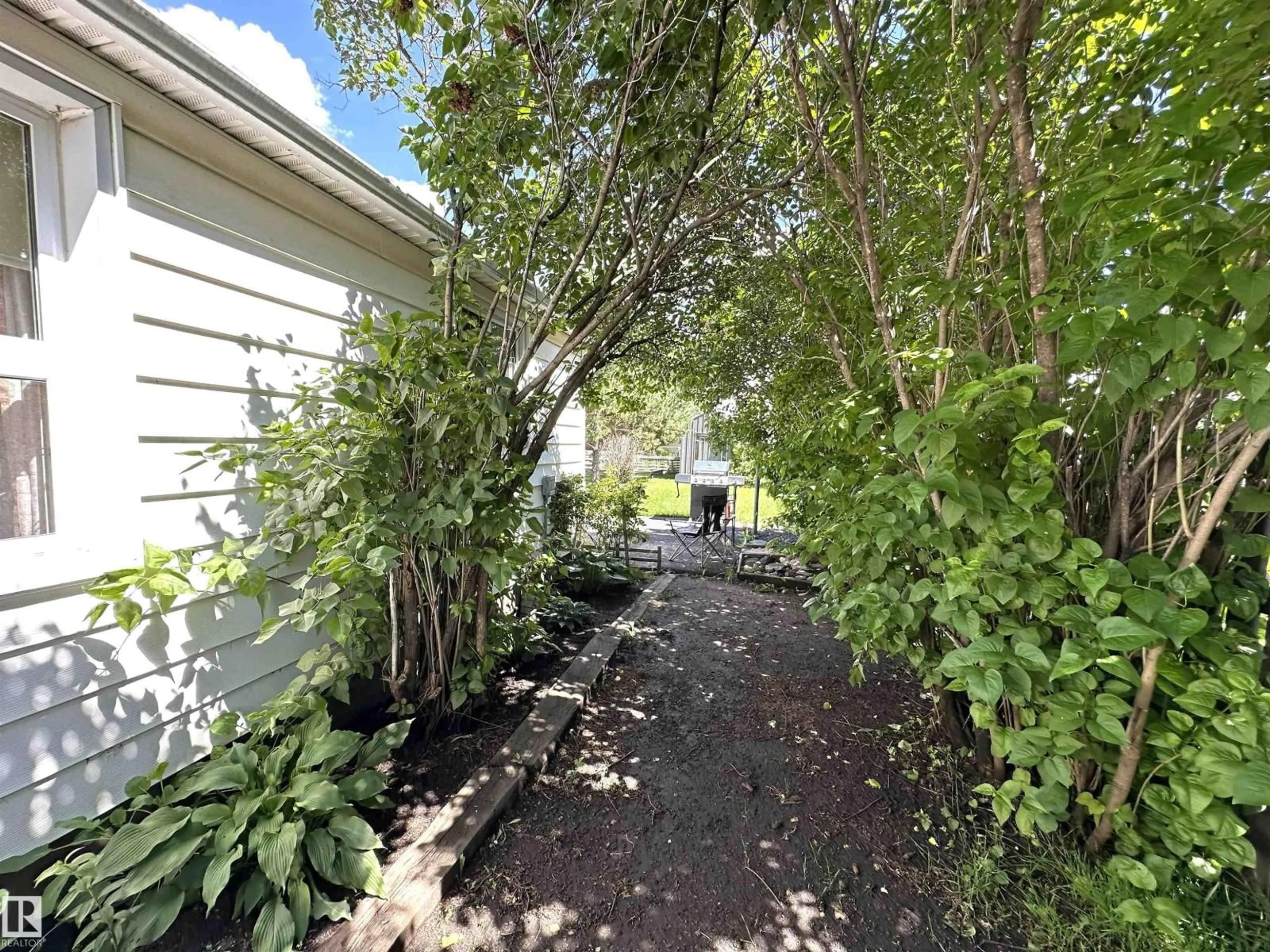A pic from outside/outdoor area/front of a property/back of a property/a pic from drone, street for 825 2 ST, Thorhild Alberta T0A3J0