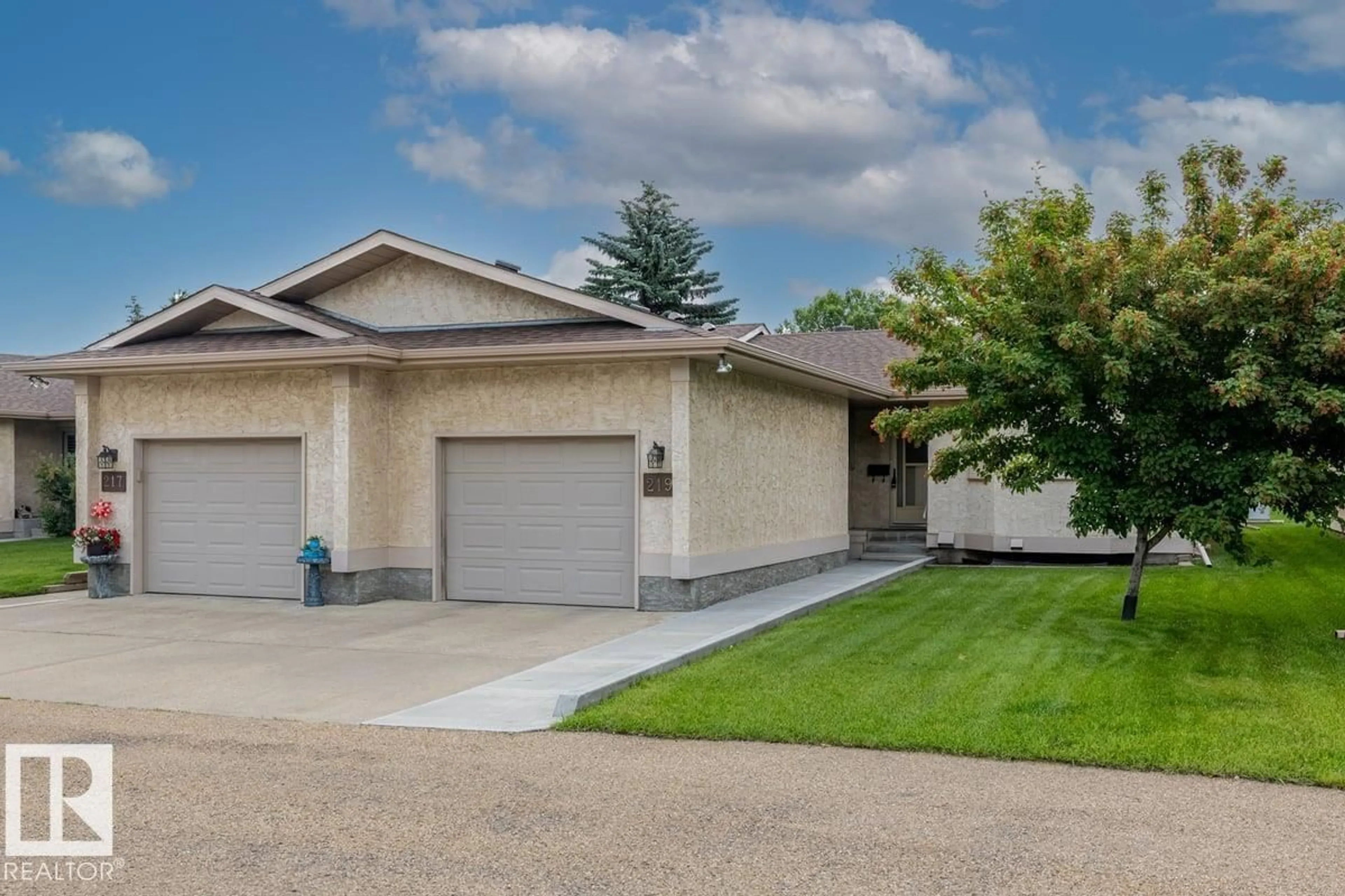 Home with vinyl exterior material, street for 219 KNOTTWOOD RD, Edmonton Alberta T6K4B9