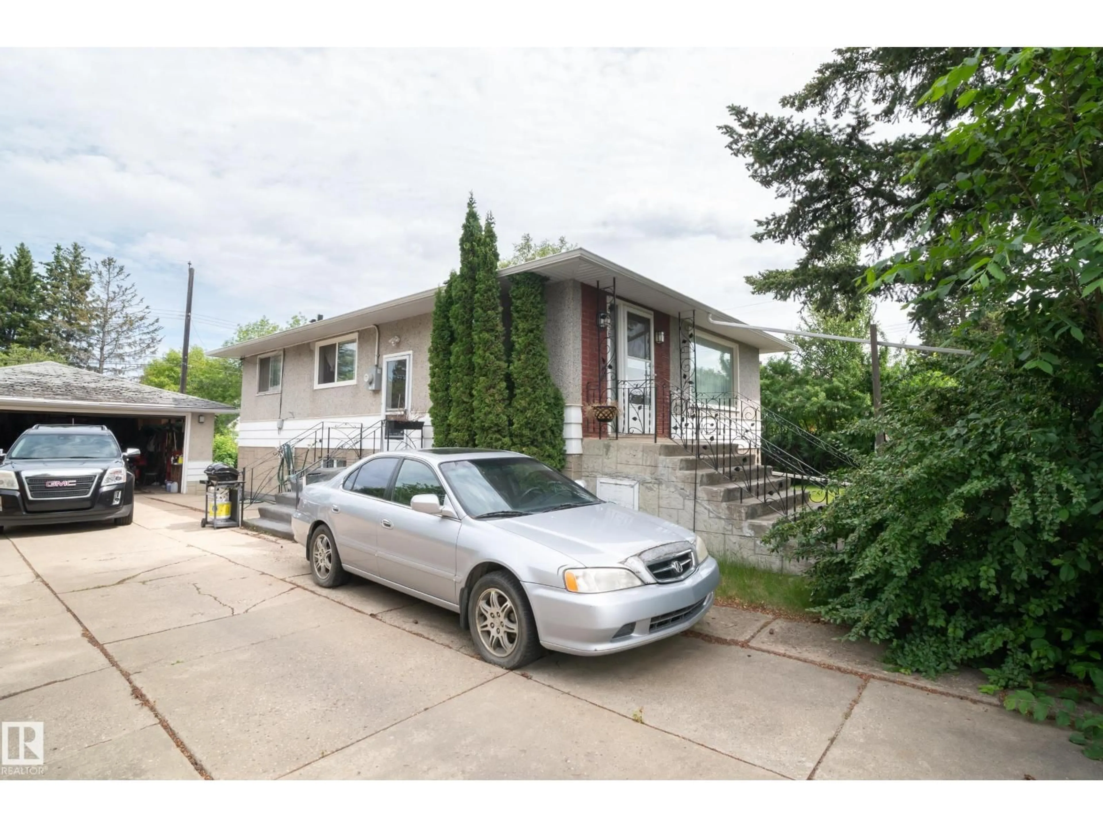 Home with vinyl exterior material, street for 8316 73 AV, Edmonton Alberta T6C0E2