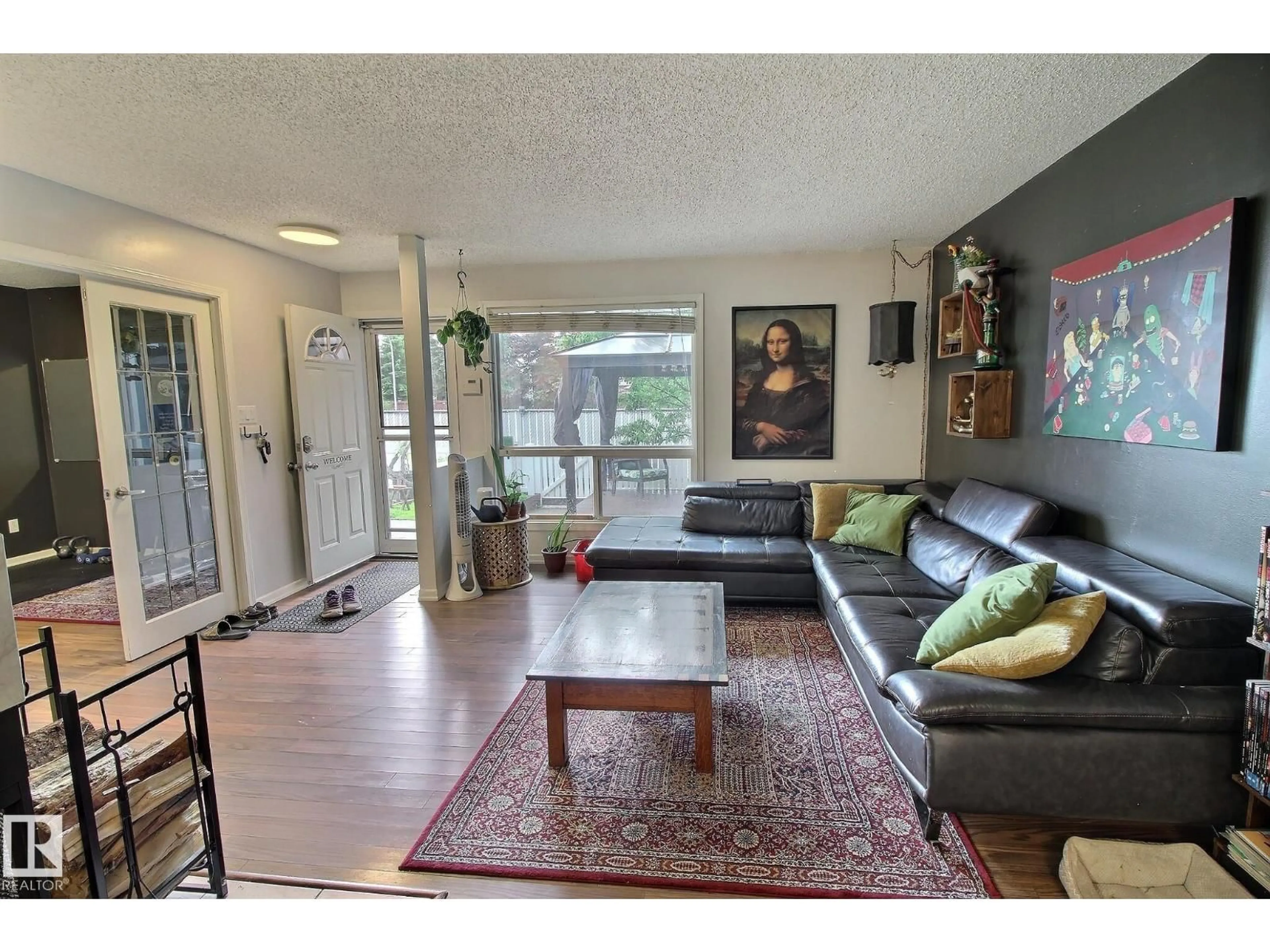 Living room with furniture, wood/laminate floor for 30 14620 26 ST NW, Edmonton Alberta T5Y2J9
