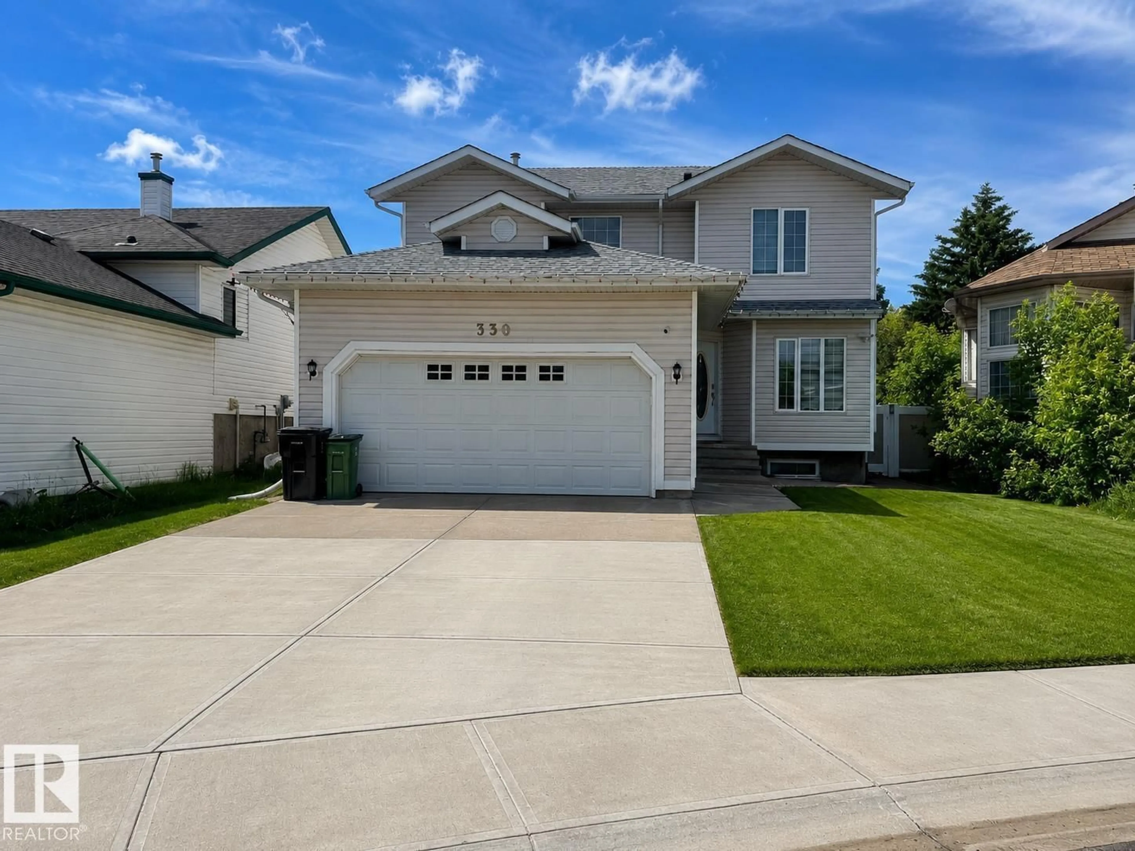 Home with vinyl exterior material, street for NW - 330 HUFFMAN CR, Edmonton Alberta T5A0C8