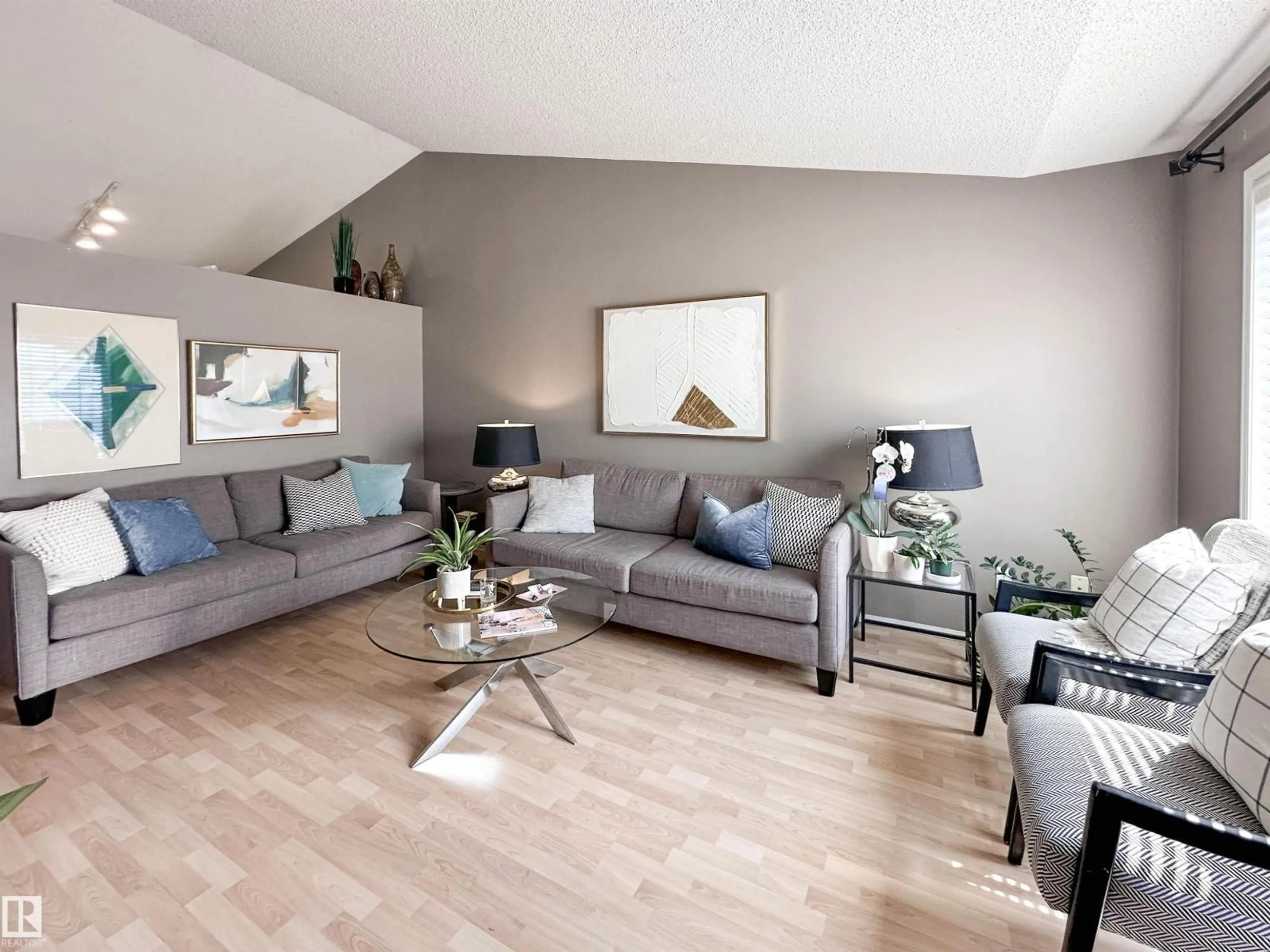 Living room with furniture, wood/laminate floor for 2116 152 AV, Edmonton Alberta T5Y2R6