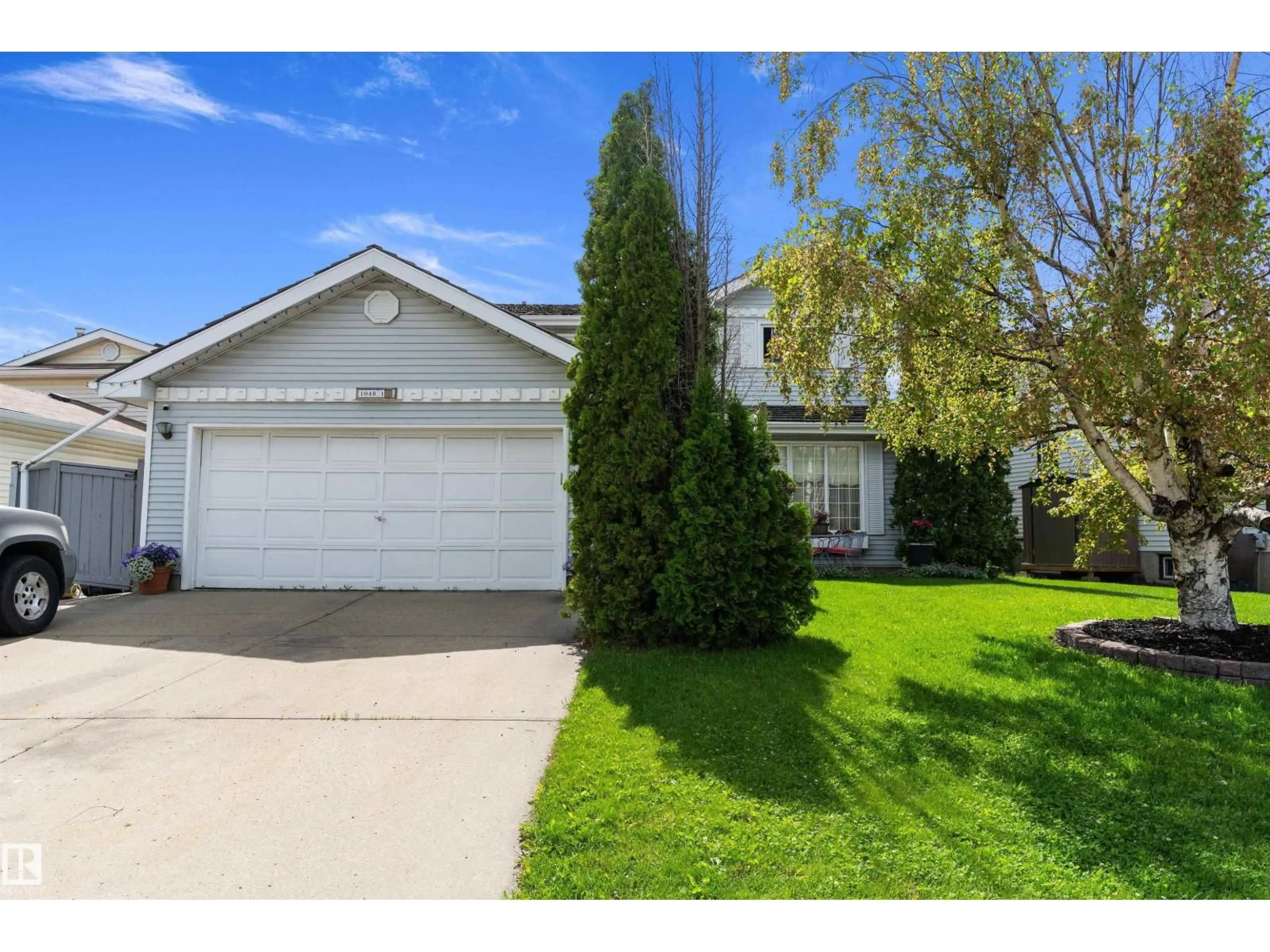 Home with vinyl exterior material, street for 1048 105 ST, Edmonton Alberta T6J6G5