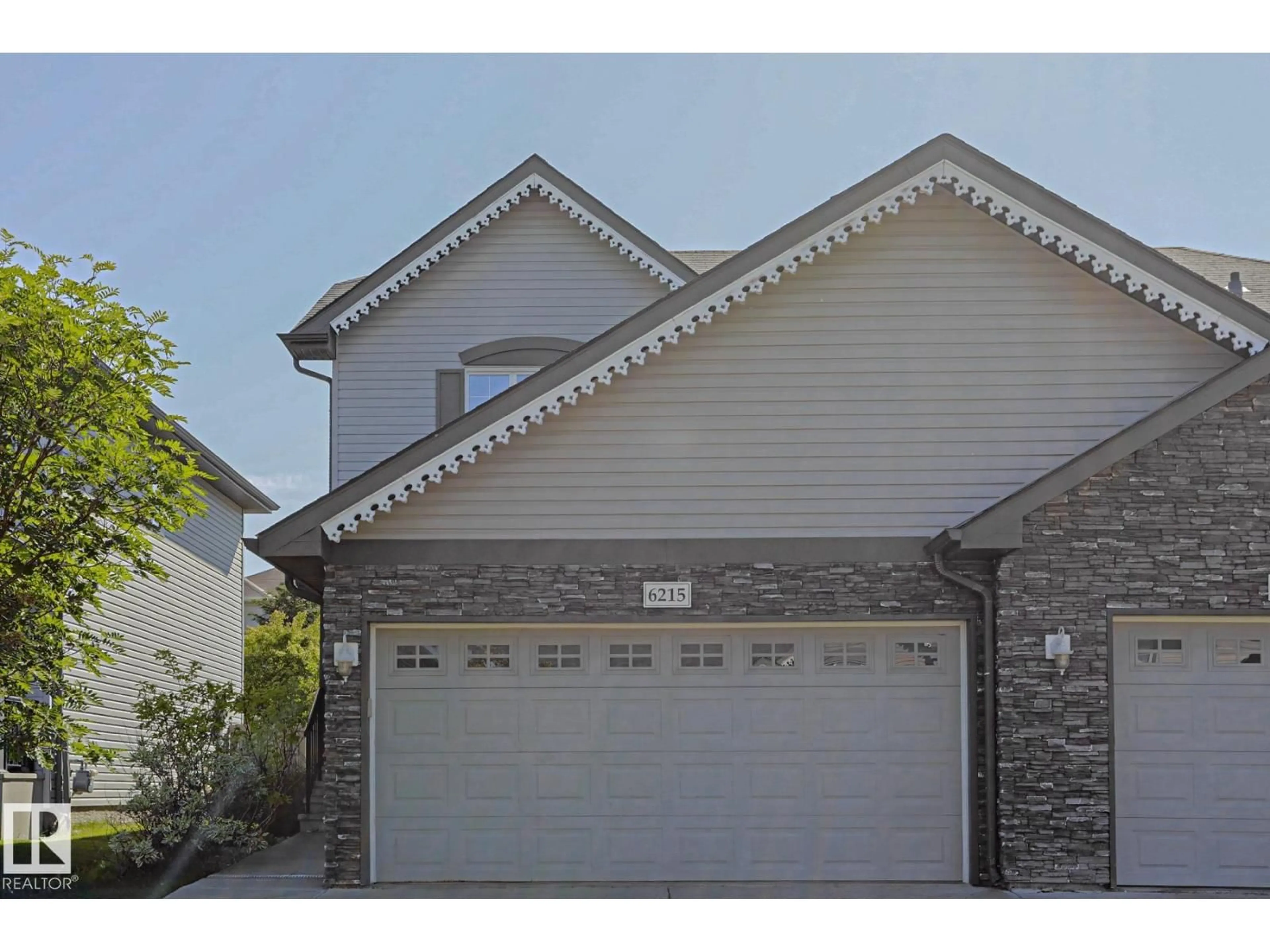 Home with vinyl exterior material, street for 6215 60 ST, Beaumont Alberta T4X0J3