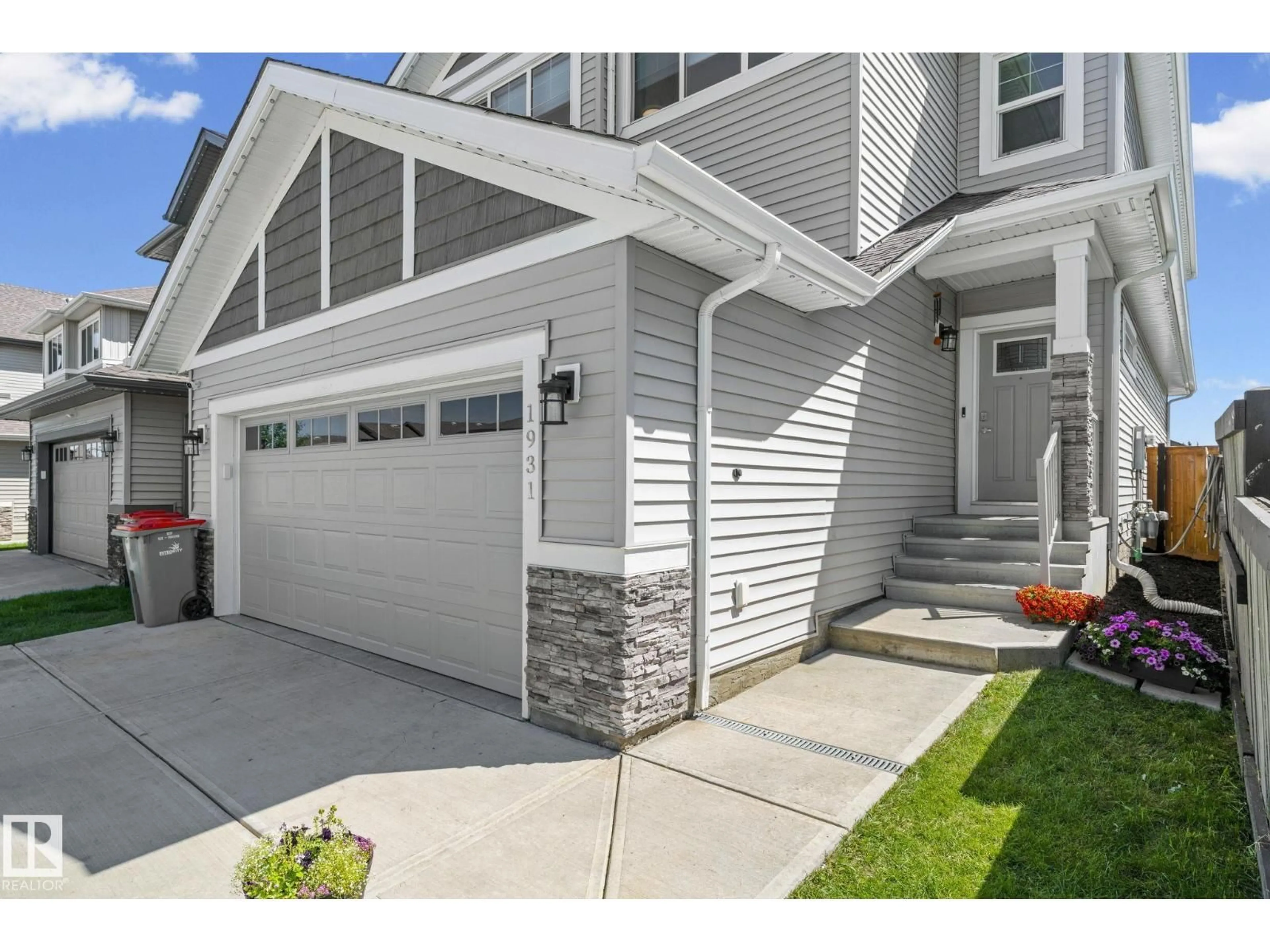 Home with vinyl exterior material, street for 1931 WESTERRA LN, Stony Plain Alberta T7Z0M9