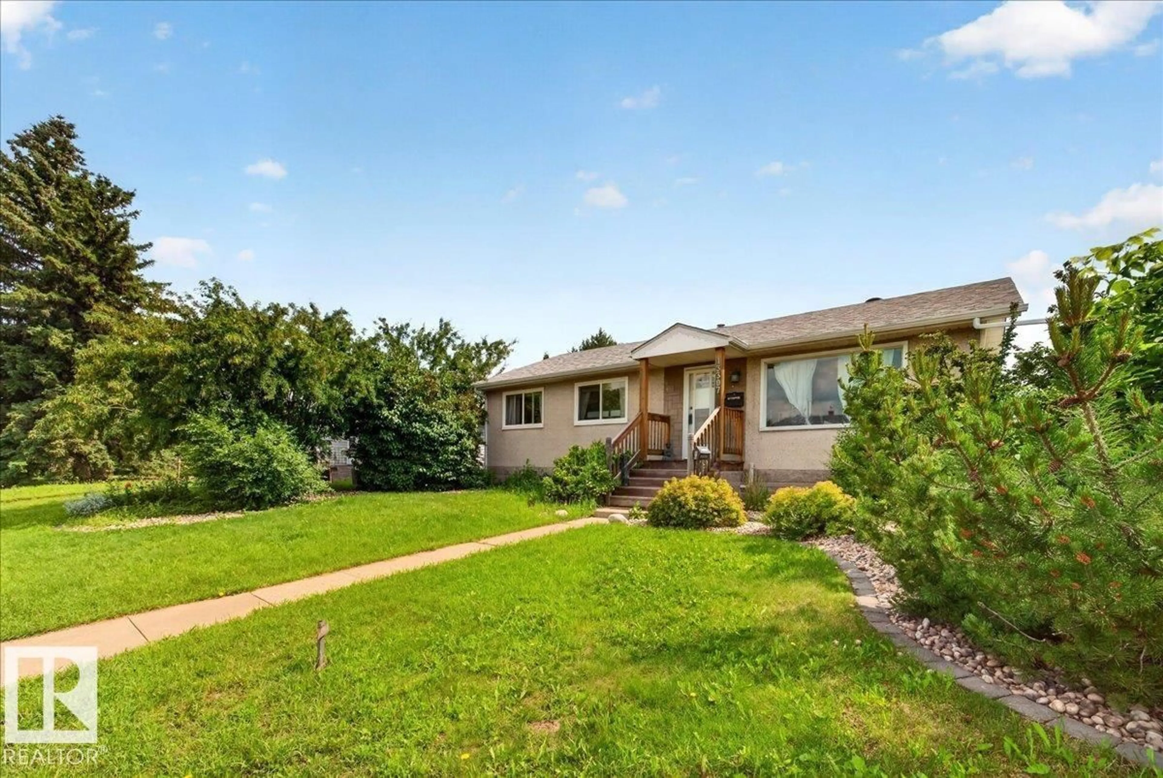 Home with vinyl exterior material, street for 13307 122 ST, Edmonton Alberta T5L0G4