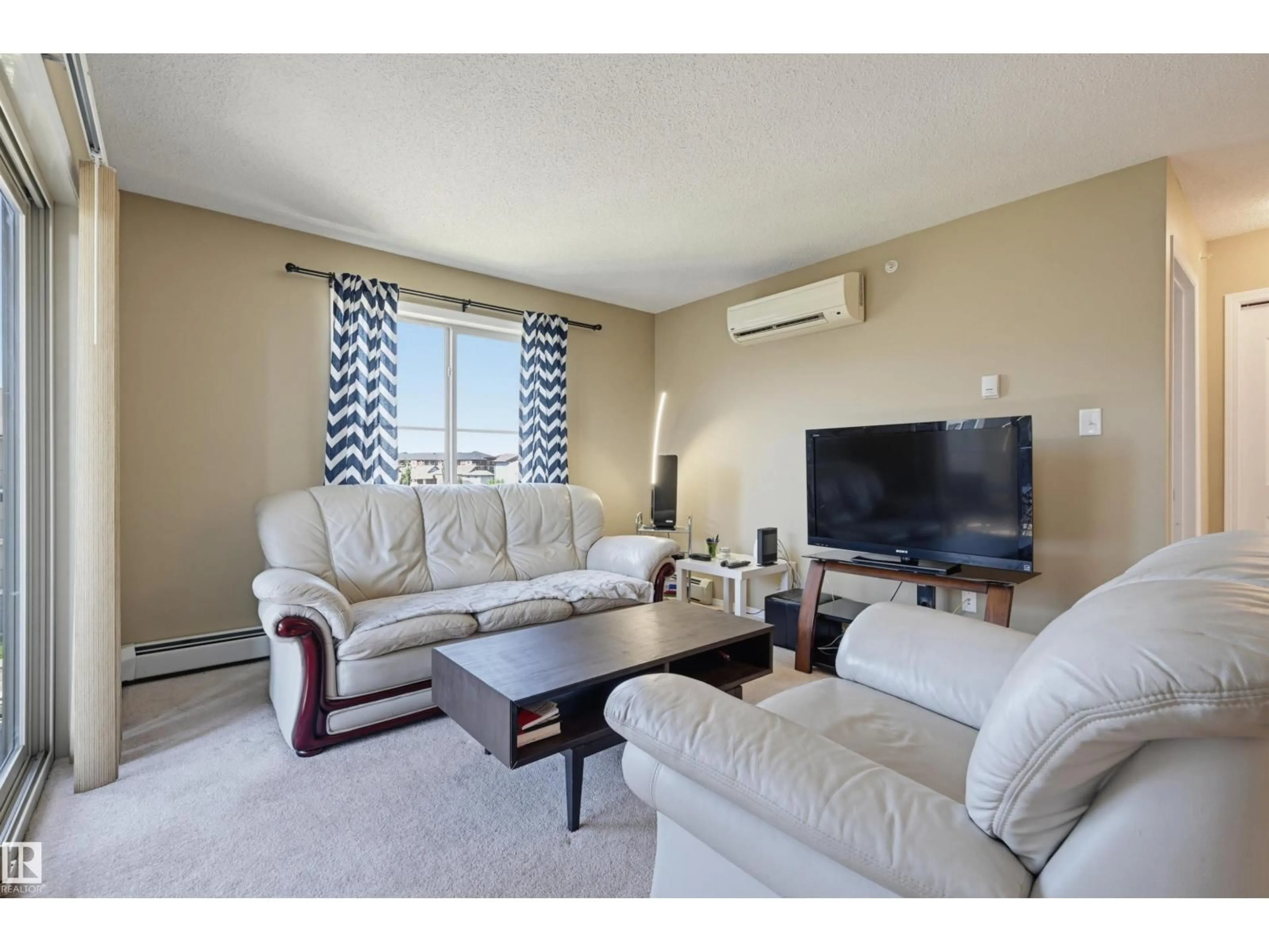 Living room with furniture, unknown for 274 - 424 MCCONACHIE DR, Edmonton Alberta T5Y3N4