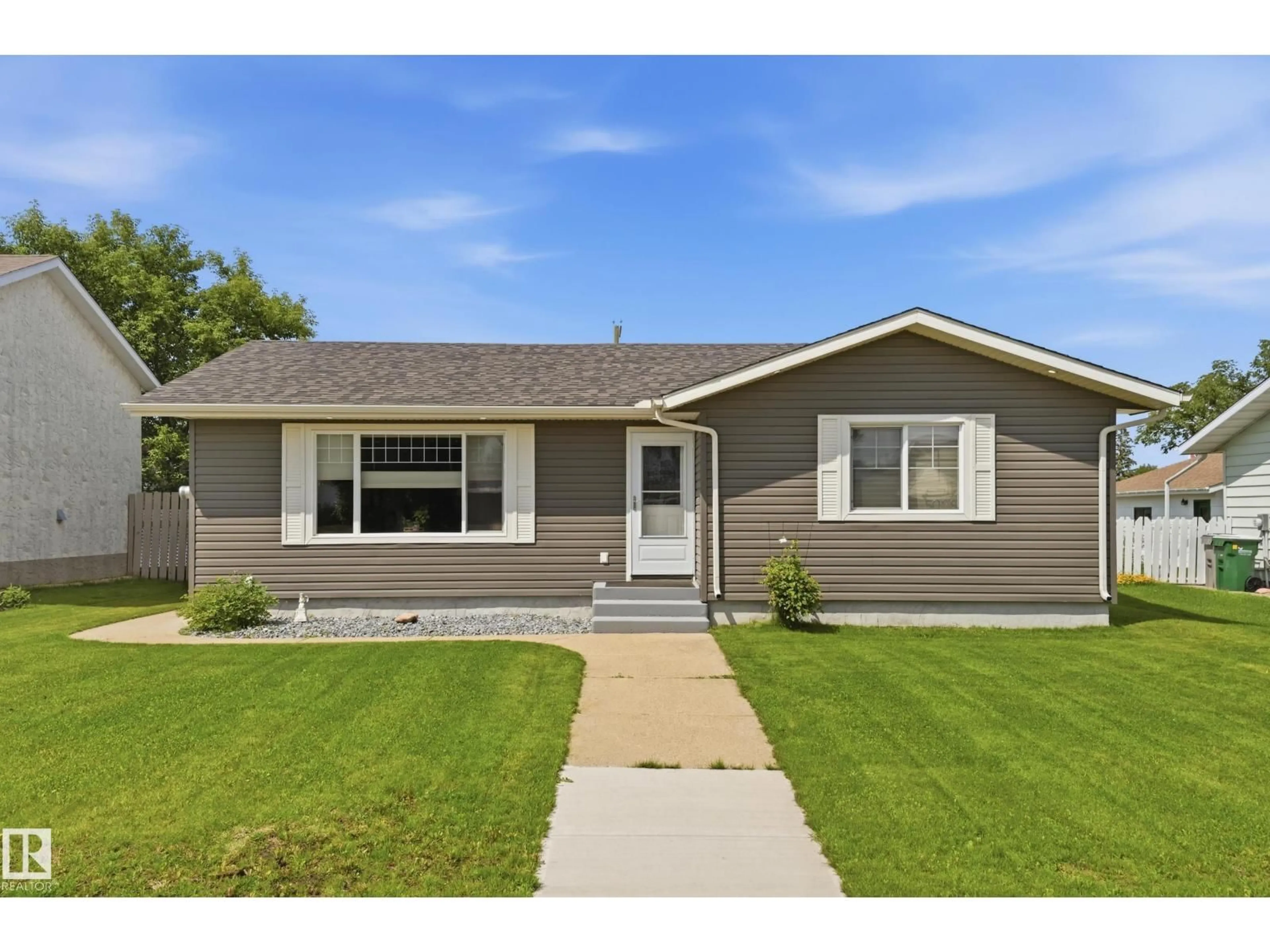 Home with vinyl exterior material, street for 5028 47 ST, Lamont Alberta T0B2R0
