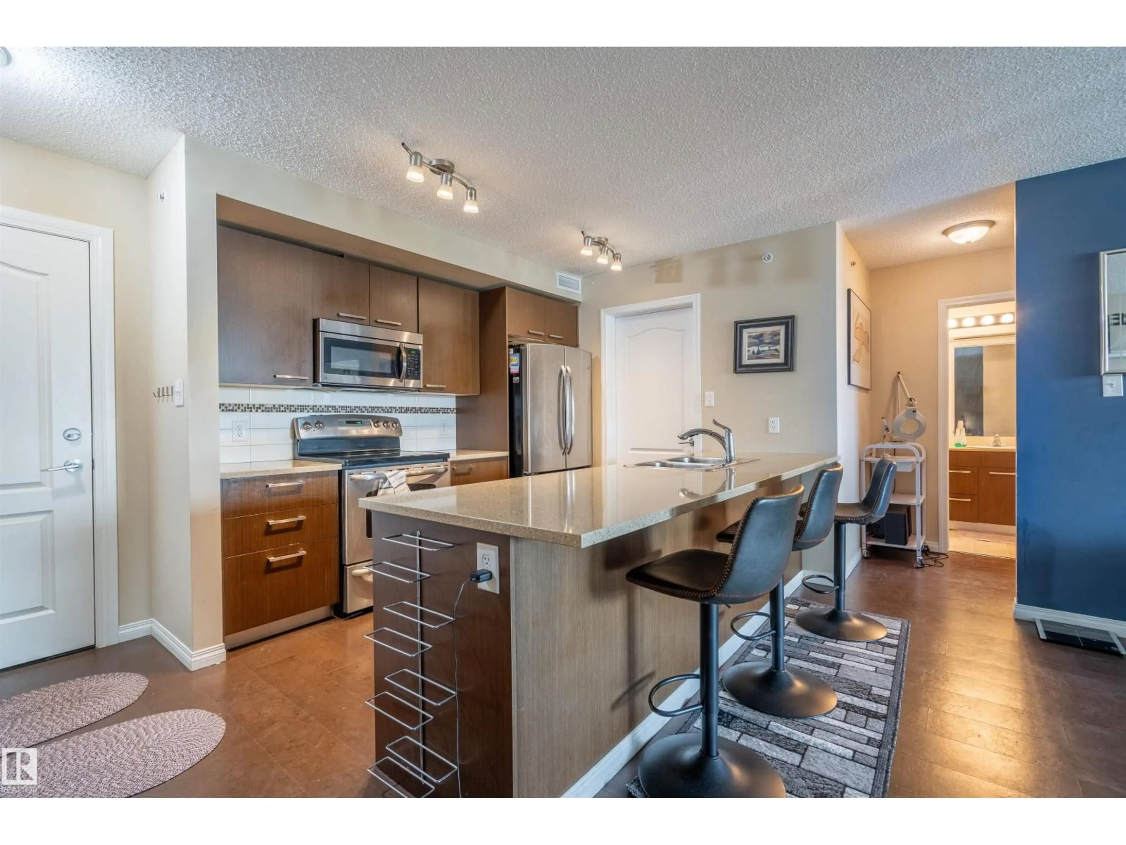 Open concept kitchen, wood/laminate floor for 2401 - 7343 SOUTH TERWILLEGAR DR, Edmonton Alberta T6R0M2