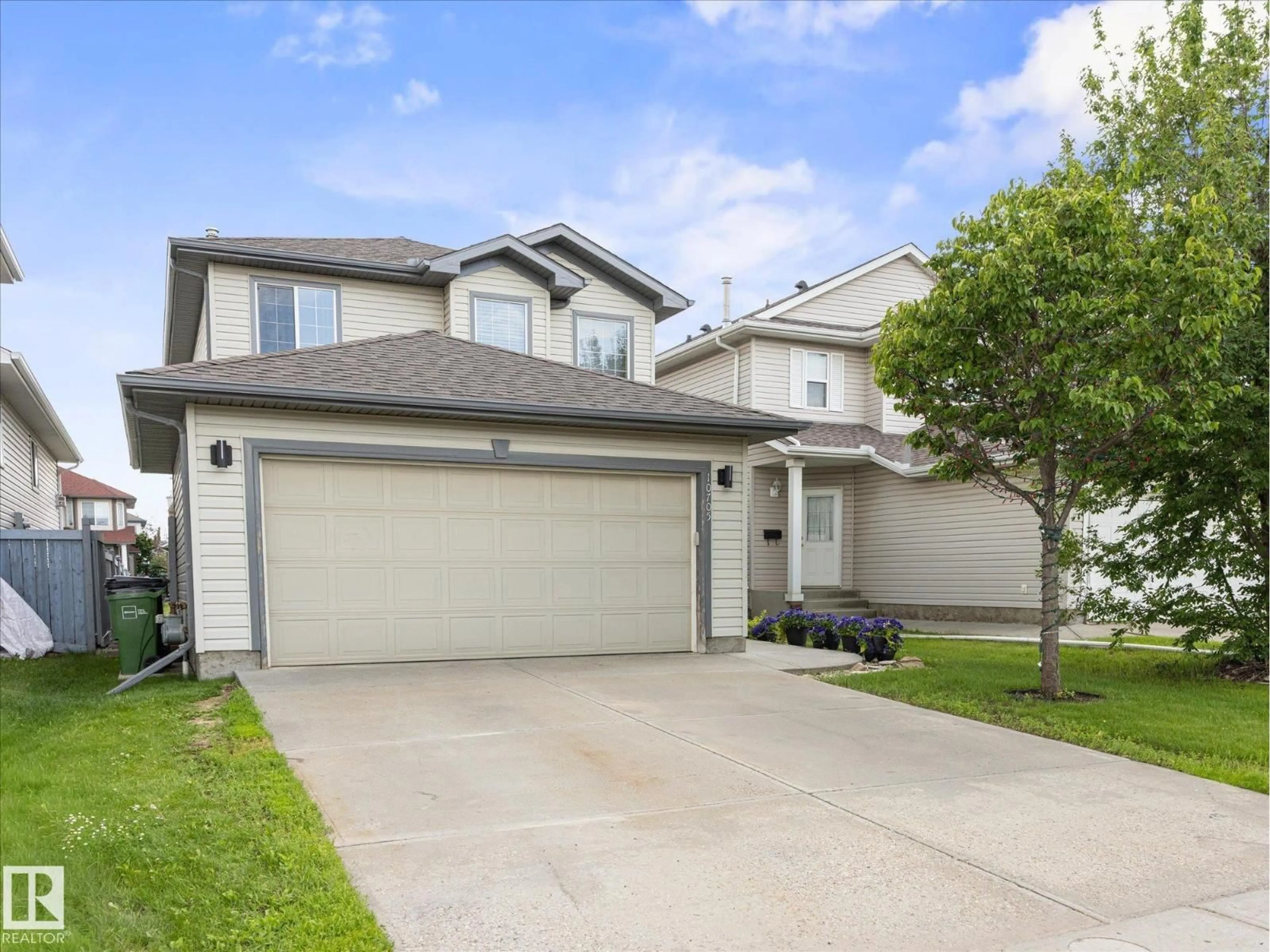 Home with vinyl exterior material, street for NW - 10705 180 AV, Edmonton Alberta T5X6C9