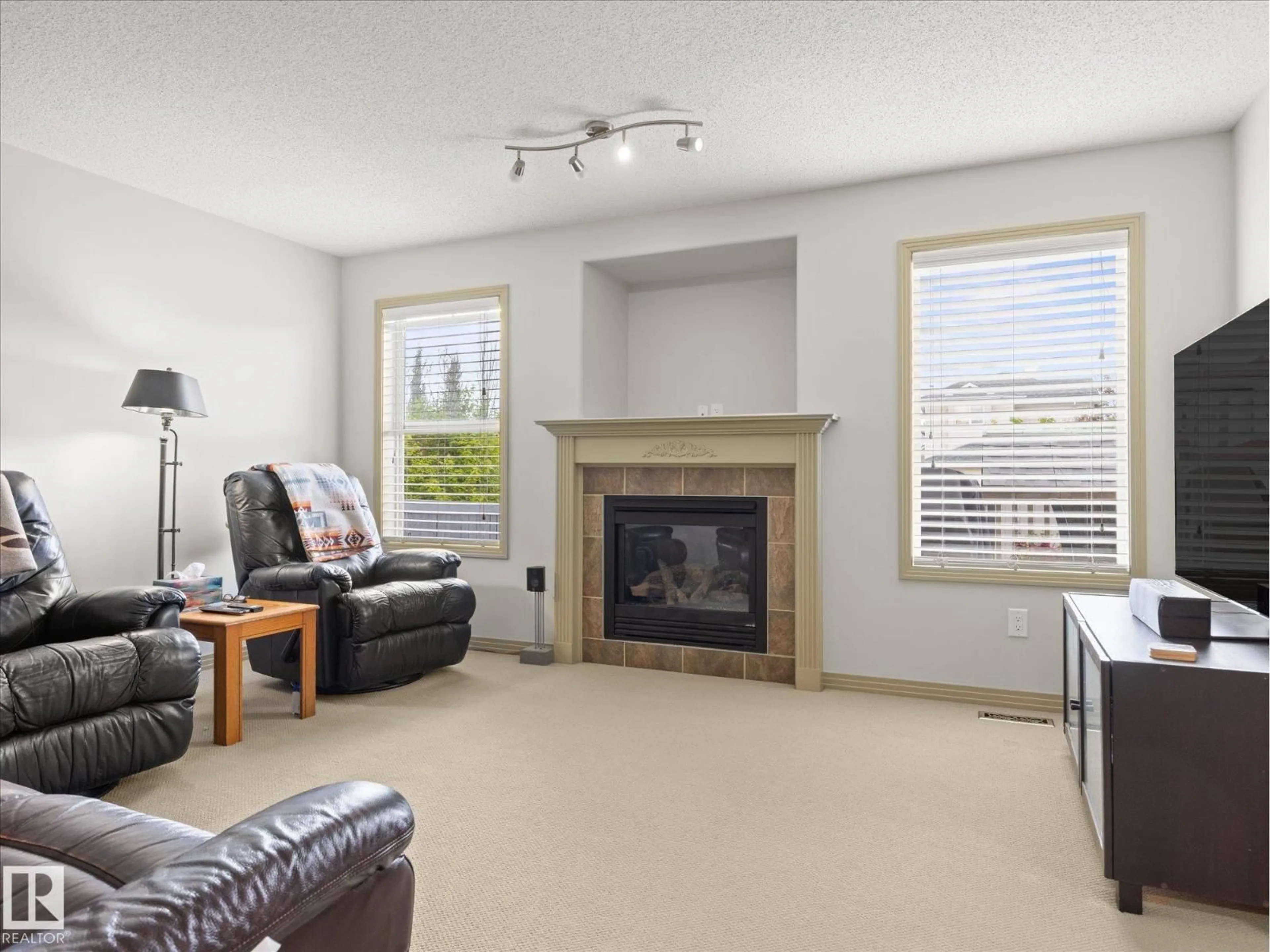 Living room with furniture, unknown for NW - 10705 180 AV, Edmonton Alberta T5X6C9