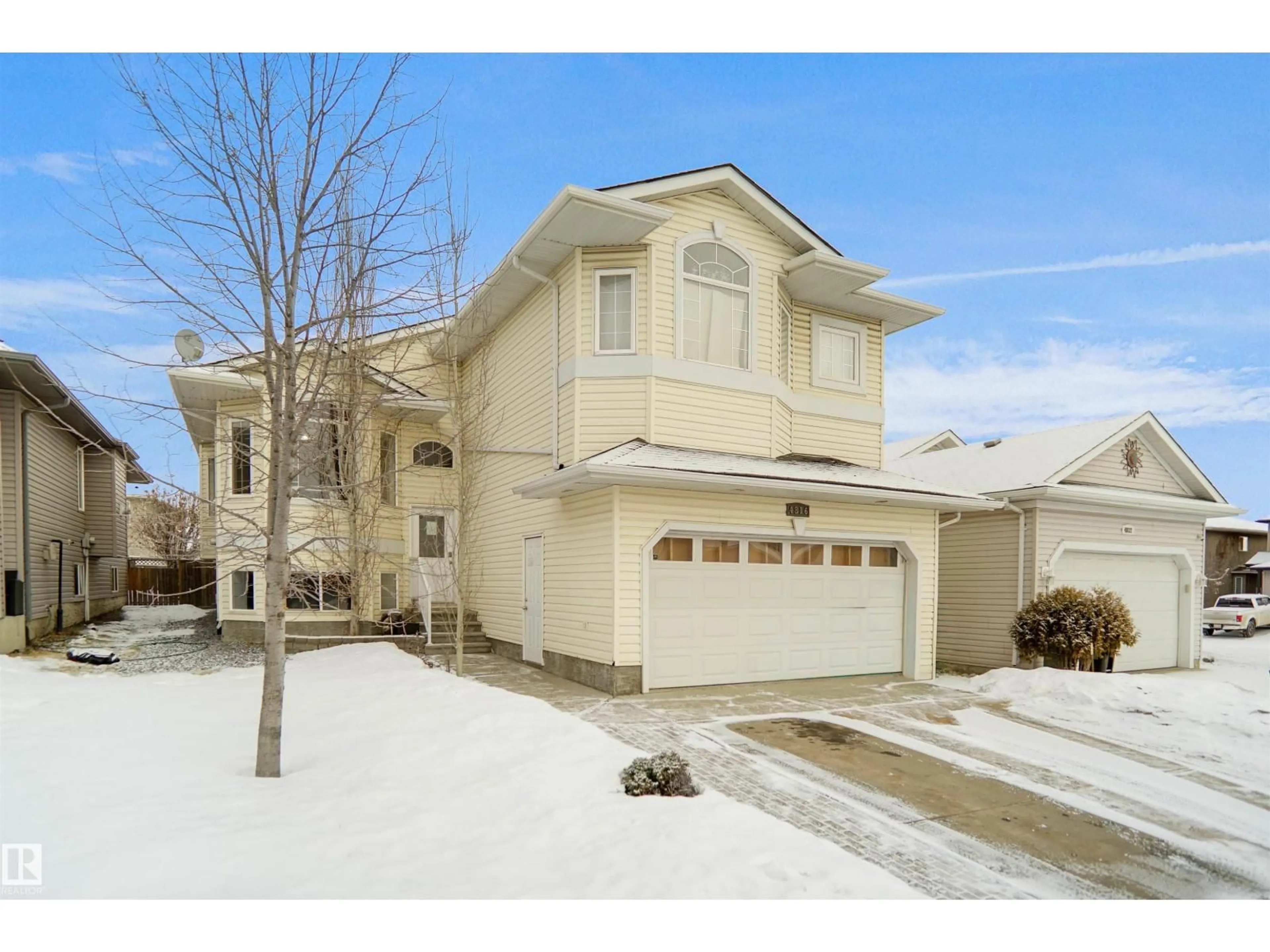 Home with vinyl exterior material, street for 4816 155 AVE, Edmonton Alberta T5Y0B9