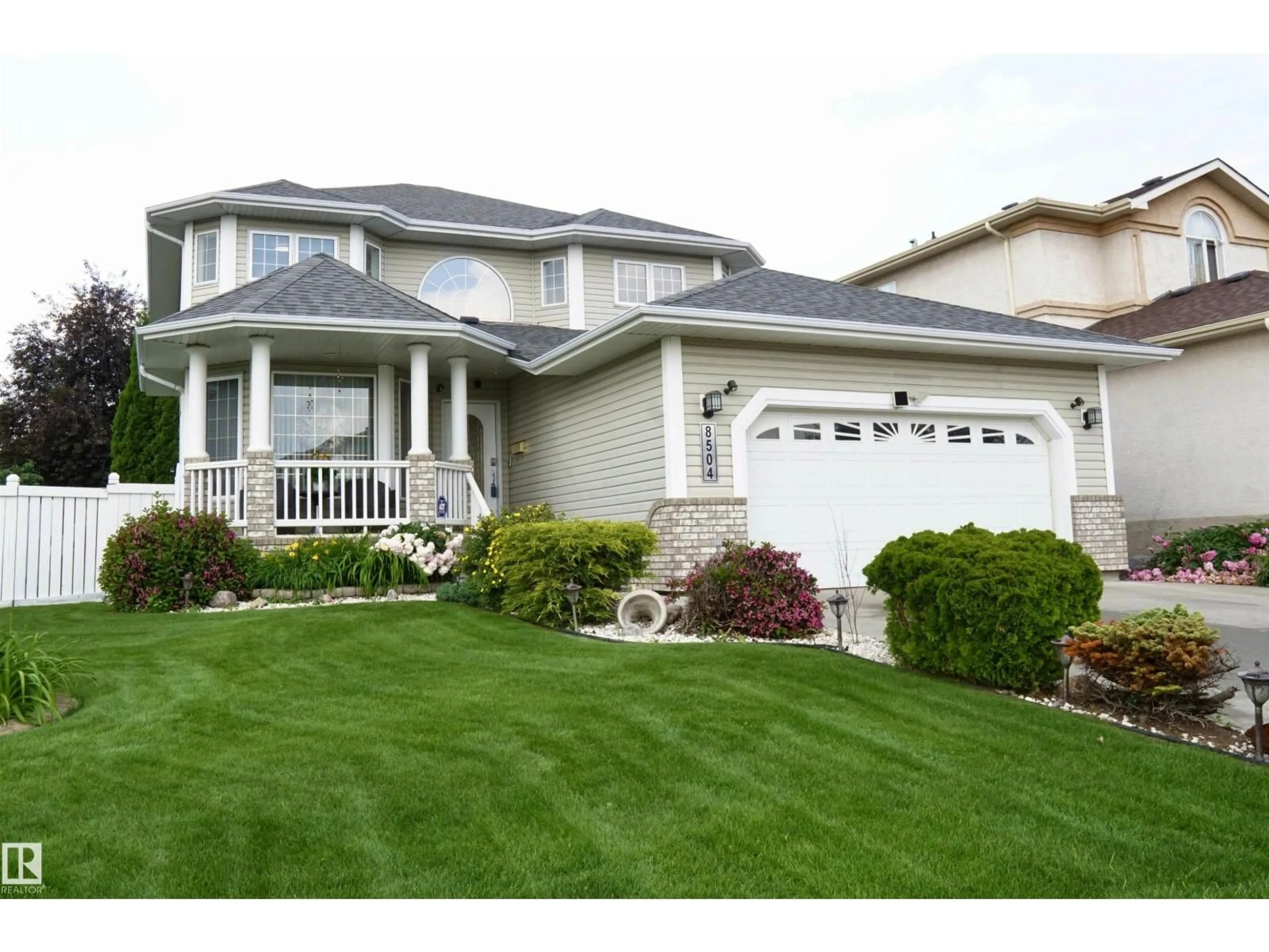 Home with vinyl exterior material, street for 8504 160A AV, Edmonton Alberta T5Z3K2