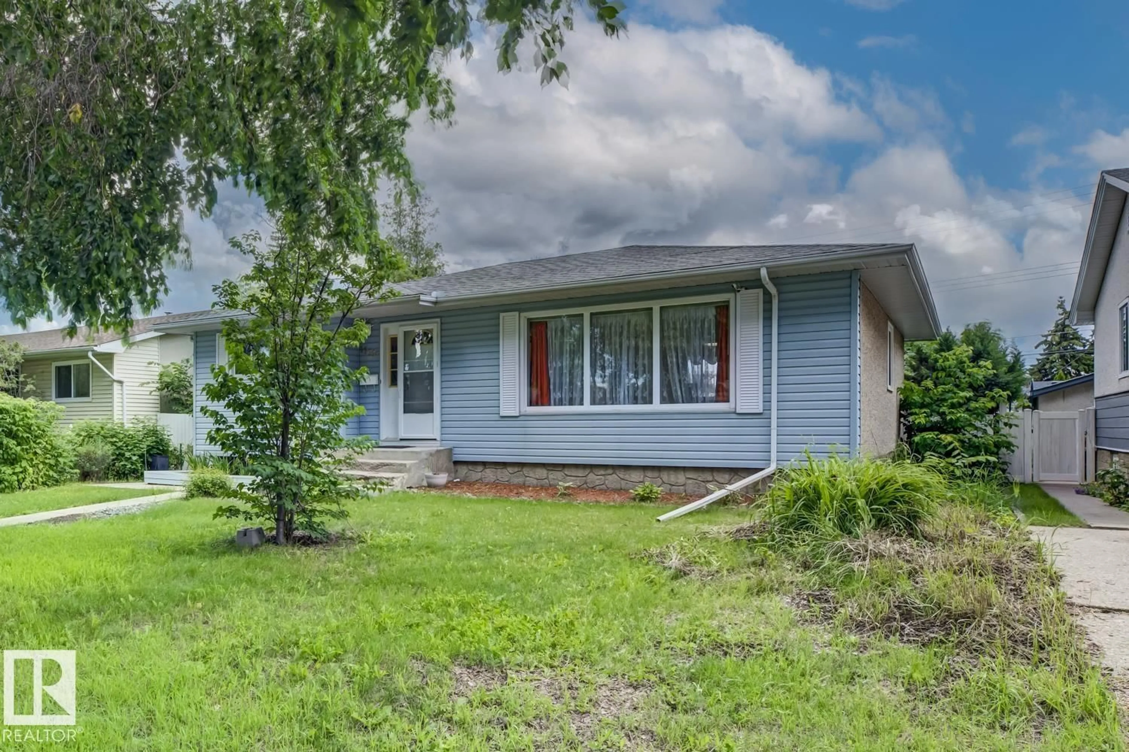Home with vinyl exterior material, street for 15707 92 AV, Edmonton Alberta T5R5C5