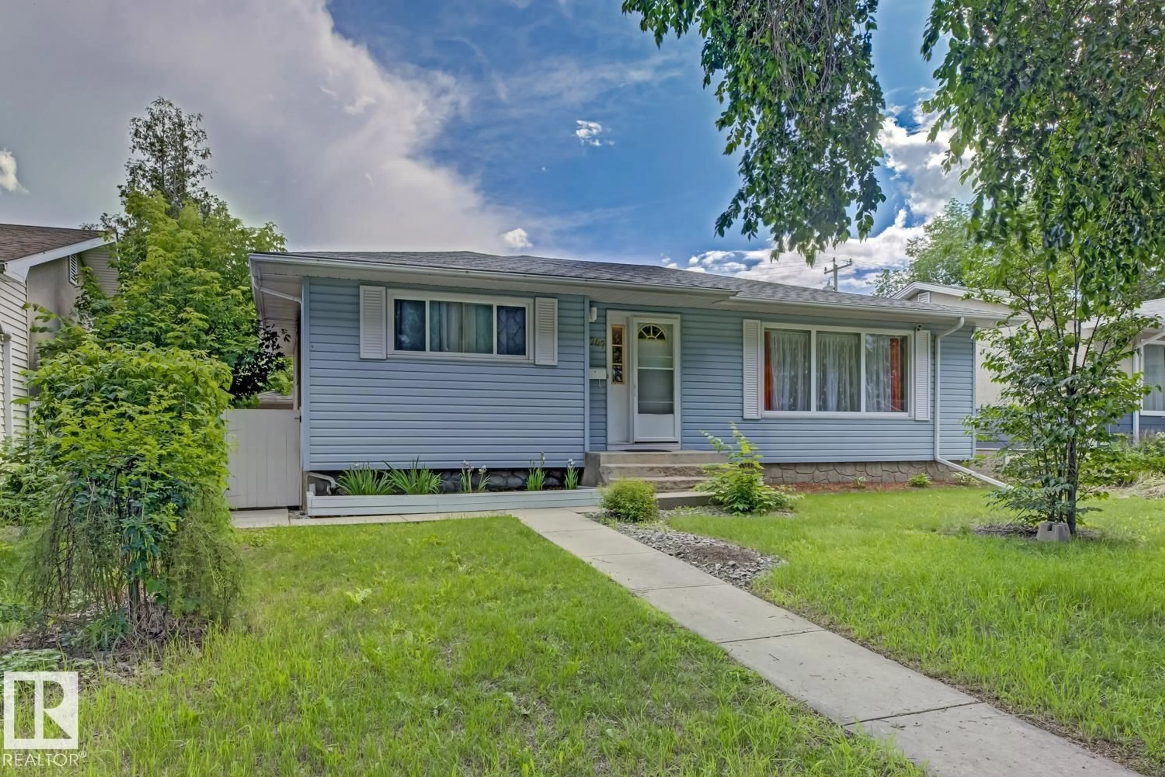 Home with vinyl exterior material, street for 15707 92 AV, Edmonton Alberta T5R5C5