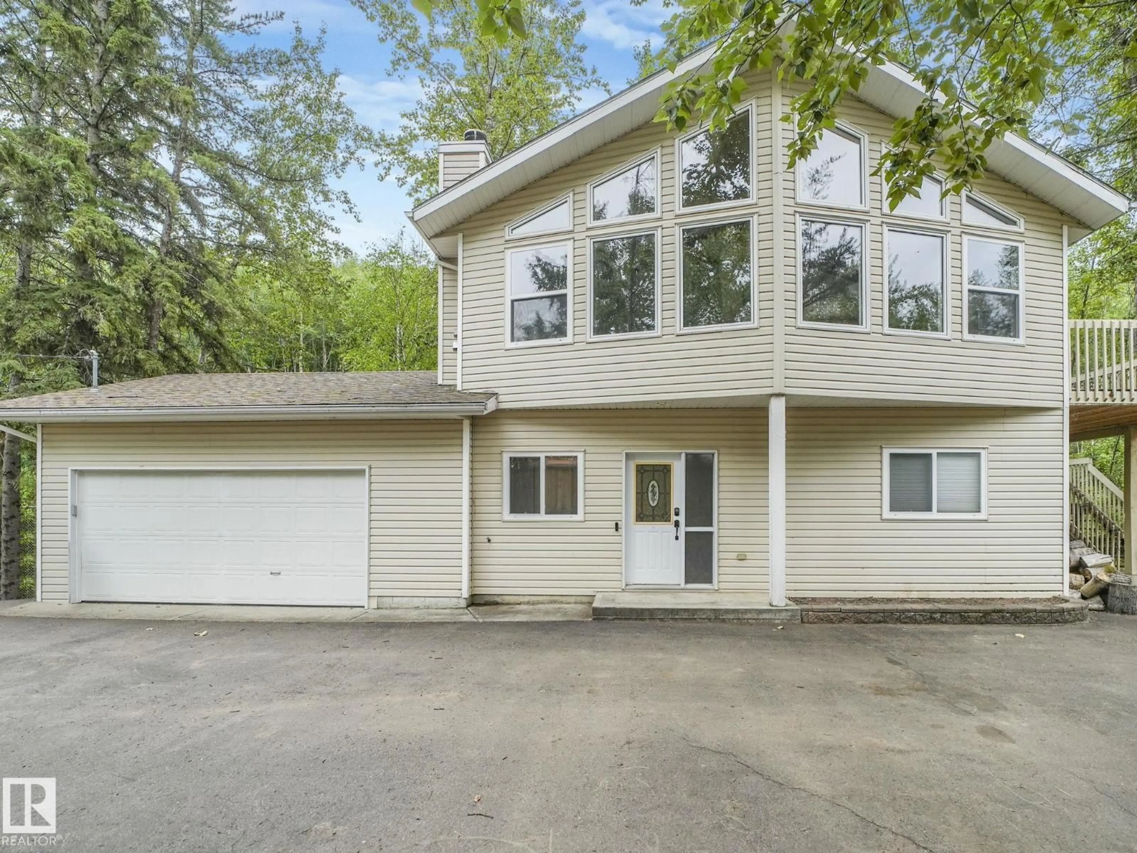 Home with vinyl exterior material, street for 615 ASH ST, Rural Sturgeon County Alberta T8R0K4
