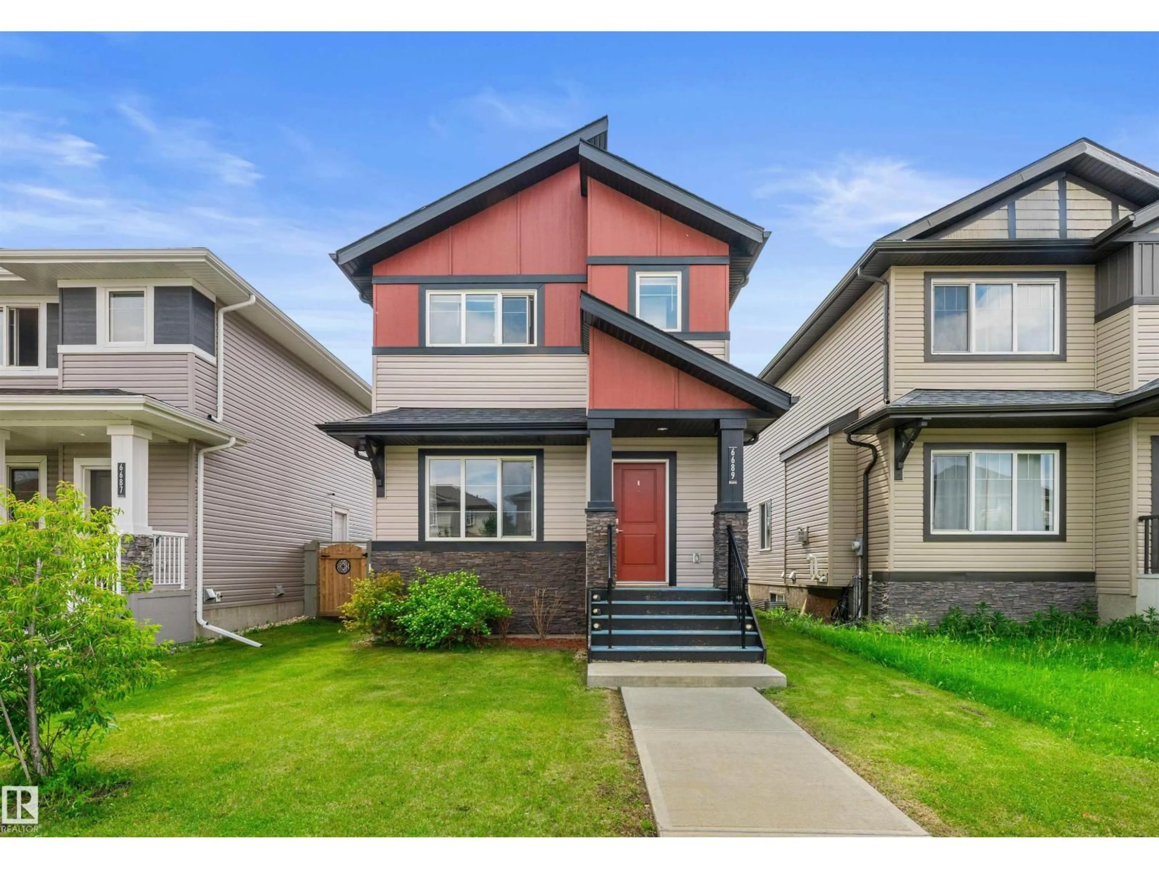 Home with vinyl exterior material, street for 6689 CARDINAL RD, Edmonton Alberta T6W2Y4