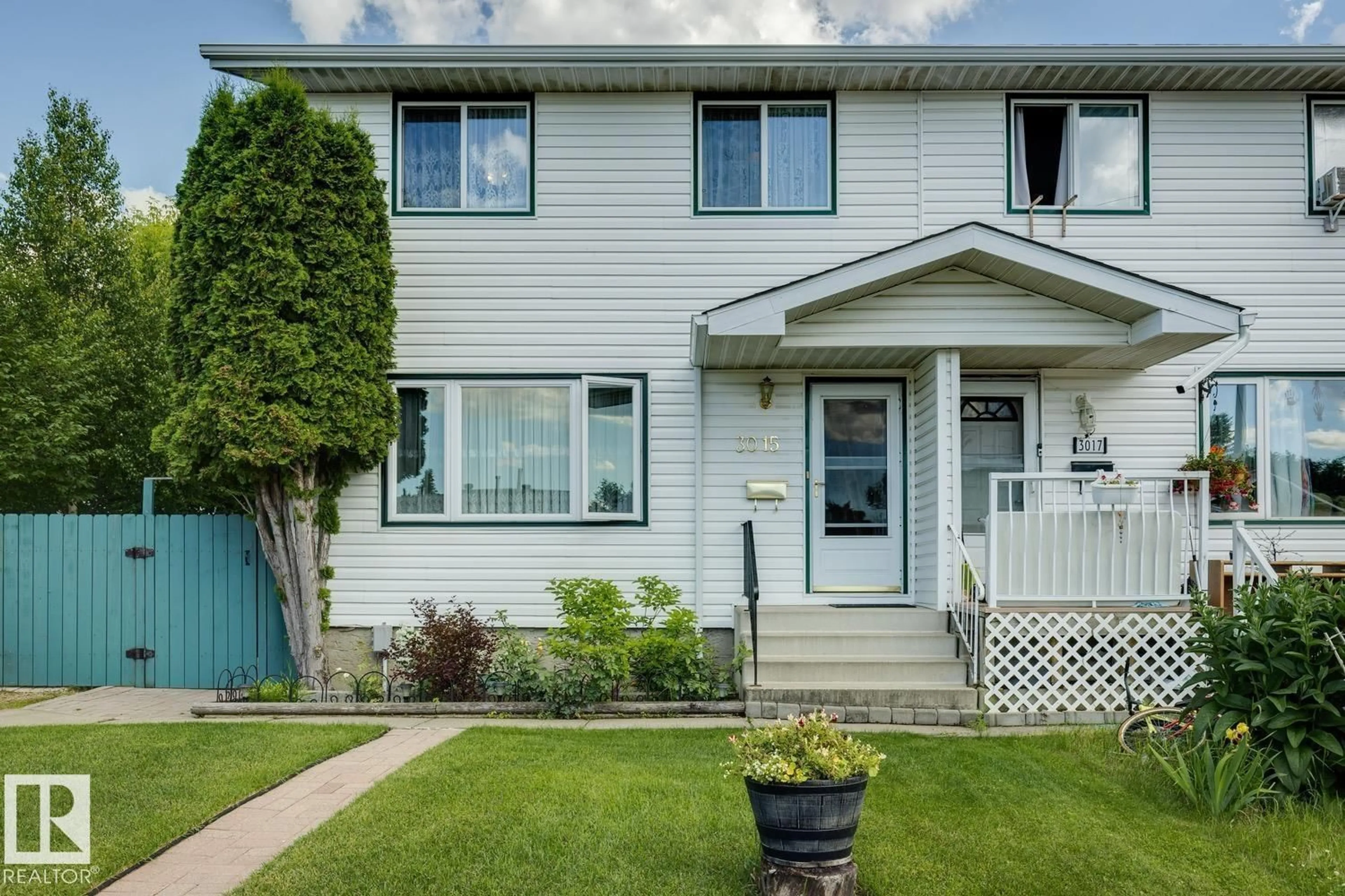 Home with vinyl exterior material, street for NW - 3015 131 AV, Edmonton Alberta T5A2Y9