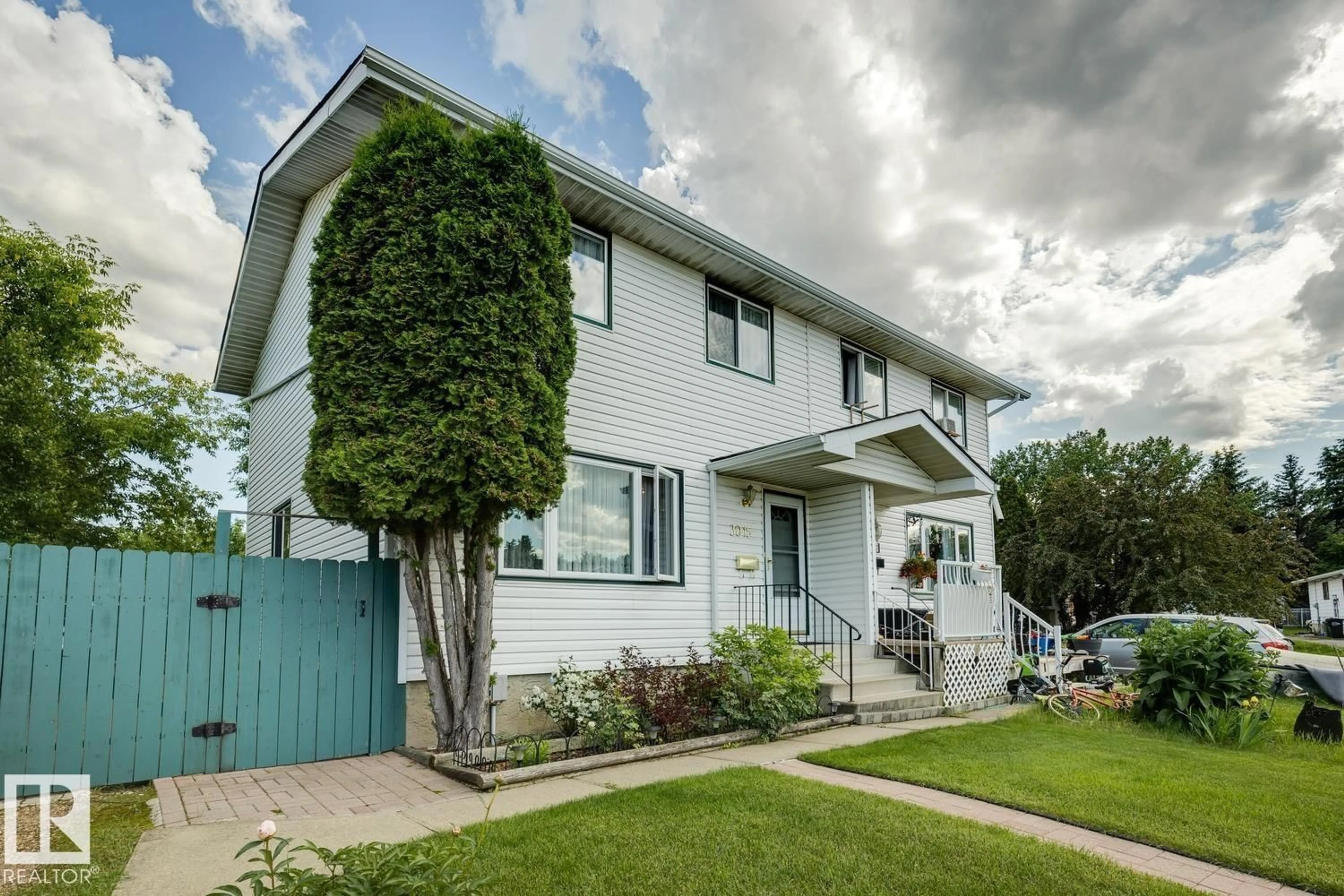 Home with vinyl exterior material, street for NW - 3015 131 AV, Edmonton Alberta T5A2Y9