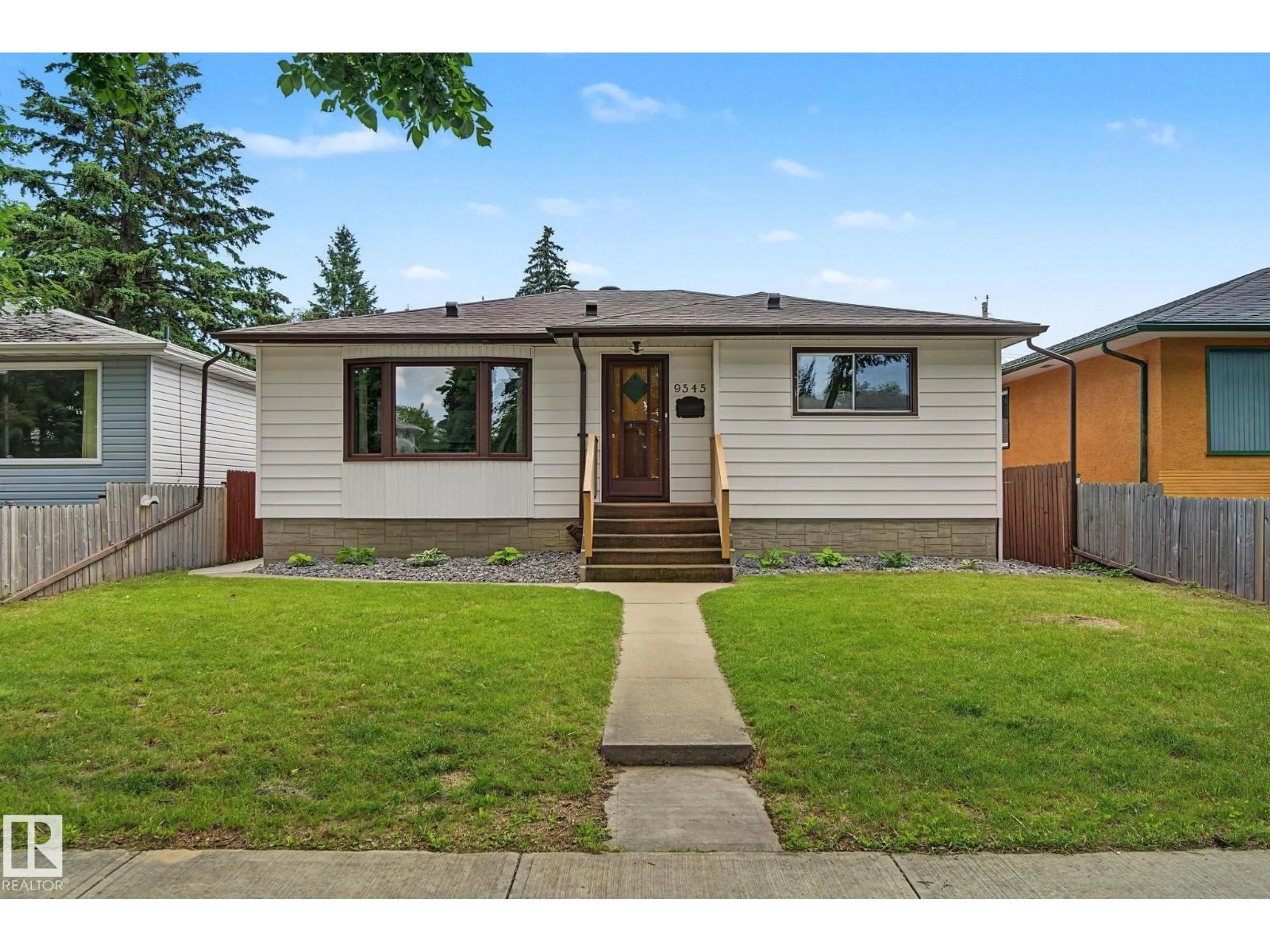 Home with vinyl exterior material, street for NW - 9545 65 AV, Edmonton Alberta T6E0K1