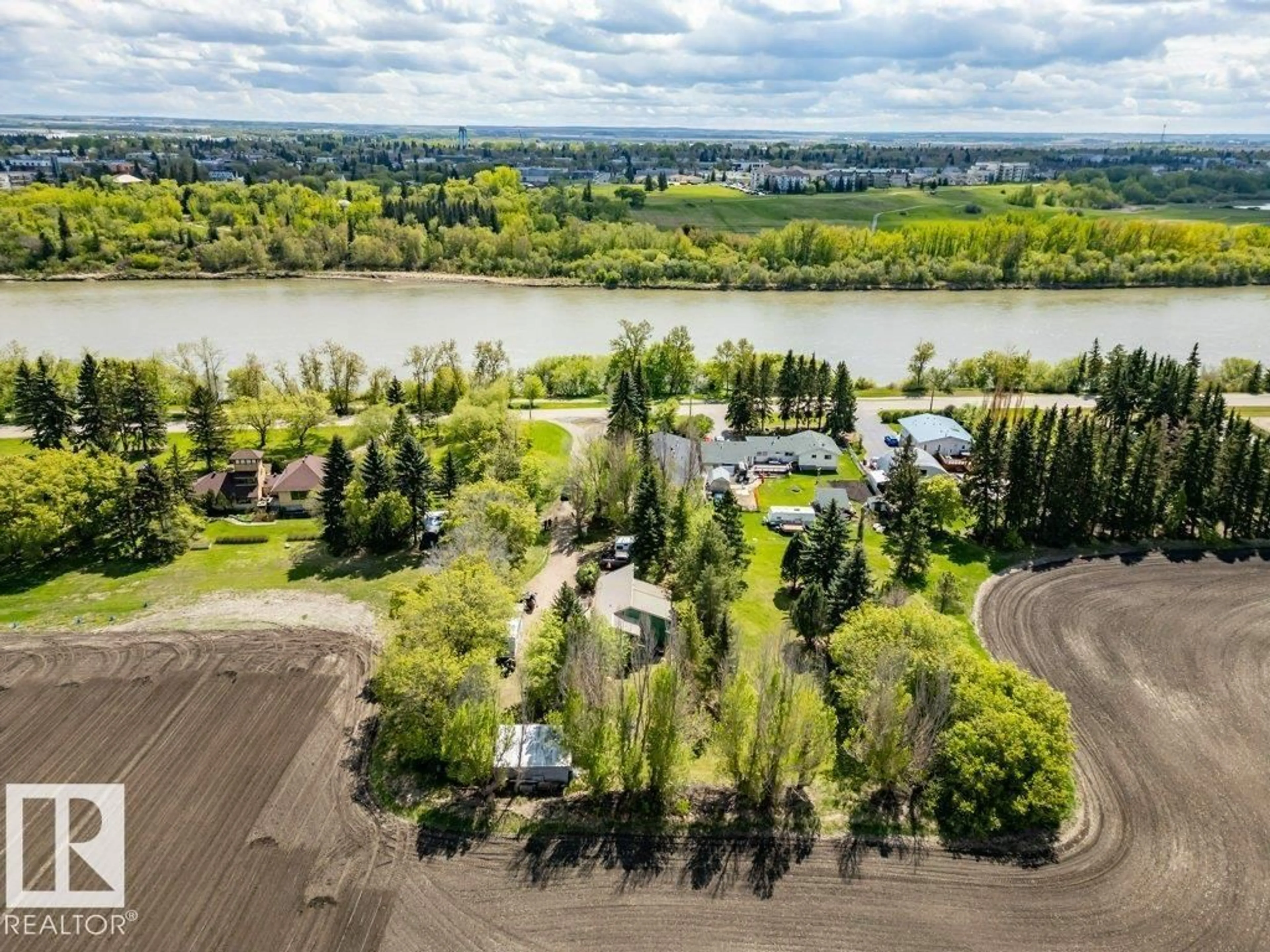 A pic from outside/outdoor area/front of a property/back of a property/a pic from drone, water/lake/river/ocean view for 55000 - 38 LAMOUREUX DR, Rural Sturgeon County Alberta T8L5A7