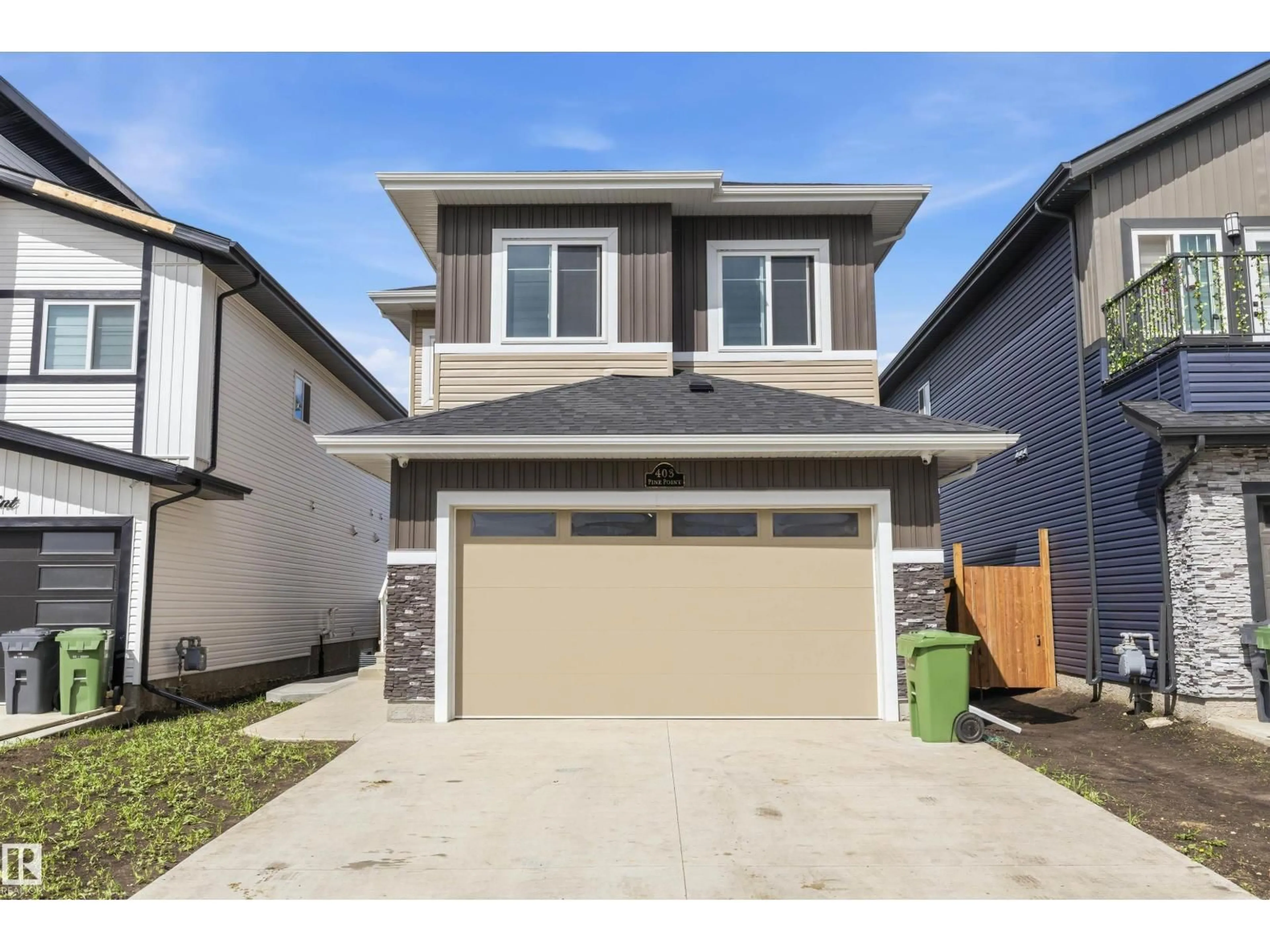 Home with vinyl exterior material, street for 403 PINE POINT, Leduc Alberta T9E1S7