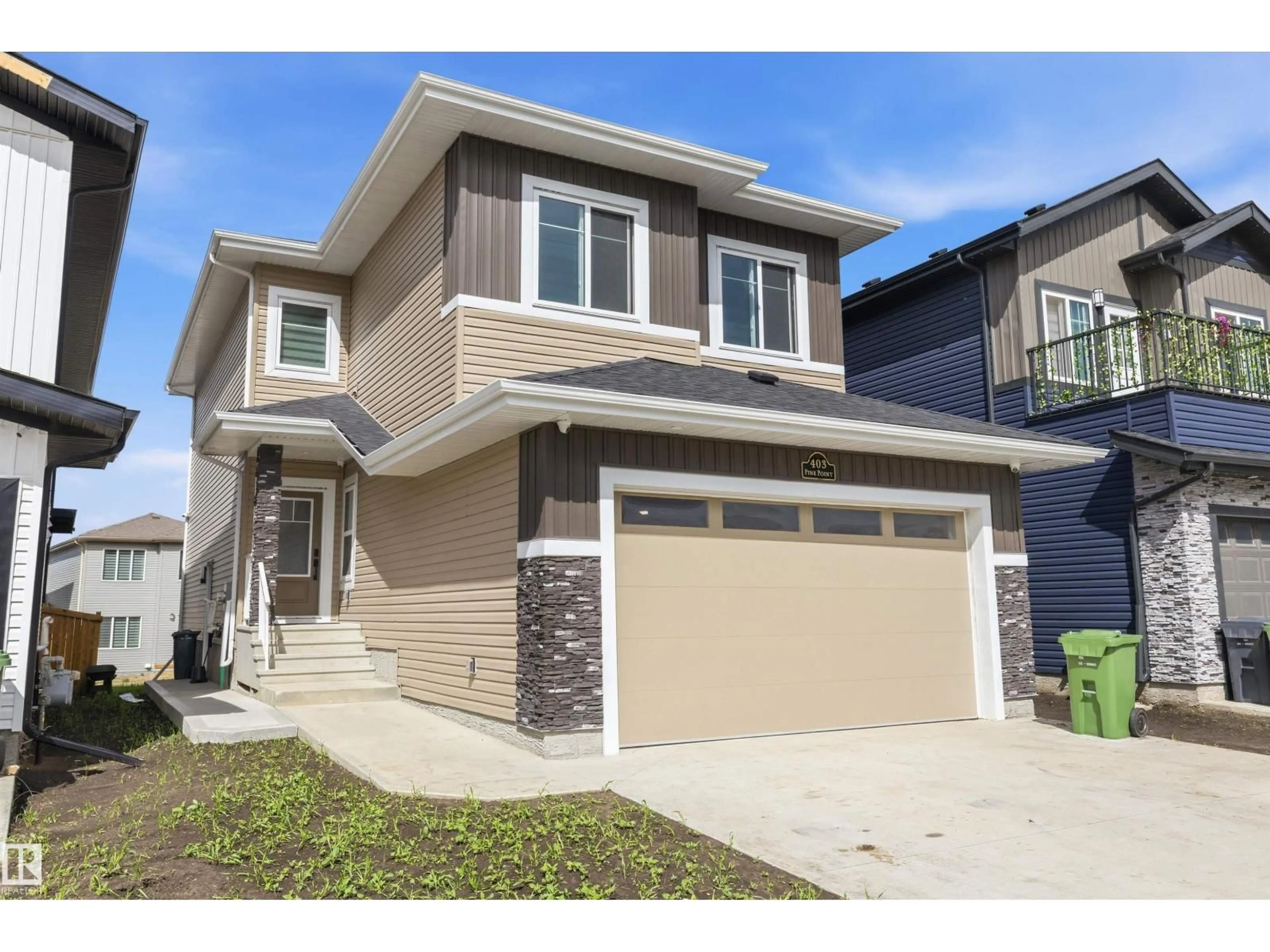 Home with vinyl exterior material, street for 403 PINE POINT, Leduc Alberta T9E1S7