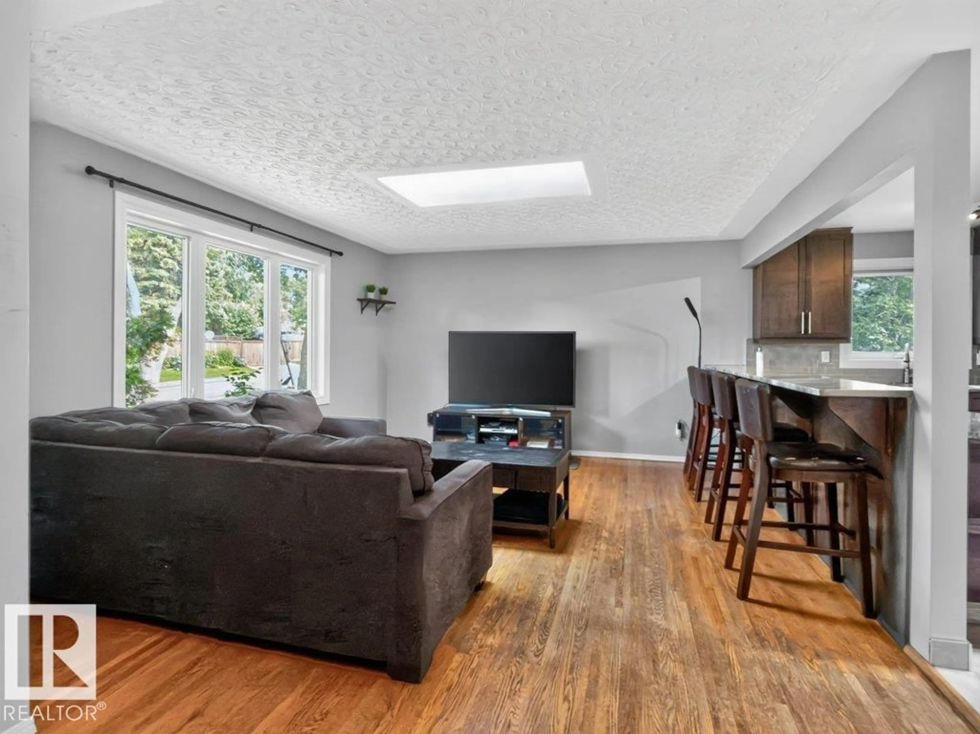 Living room with furniture, wood/laminate floor for 924 CONIFER ST, Sherwood Park Alberta T8A1N5