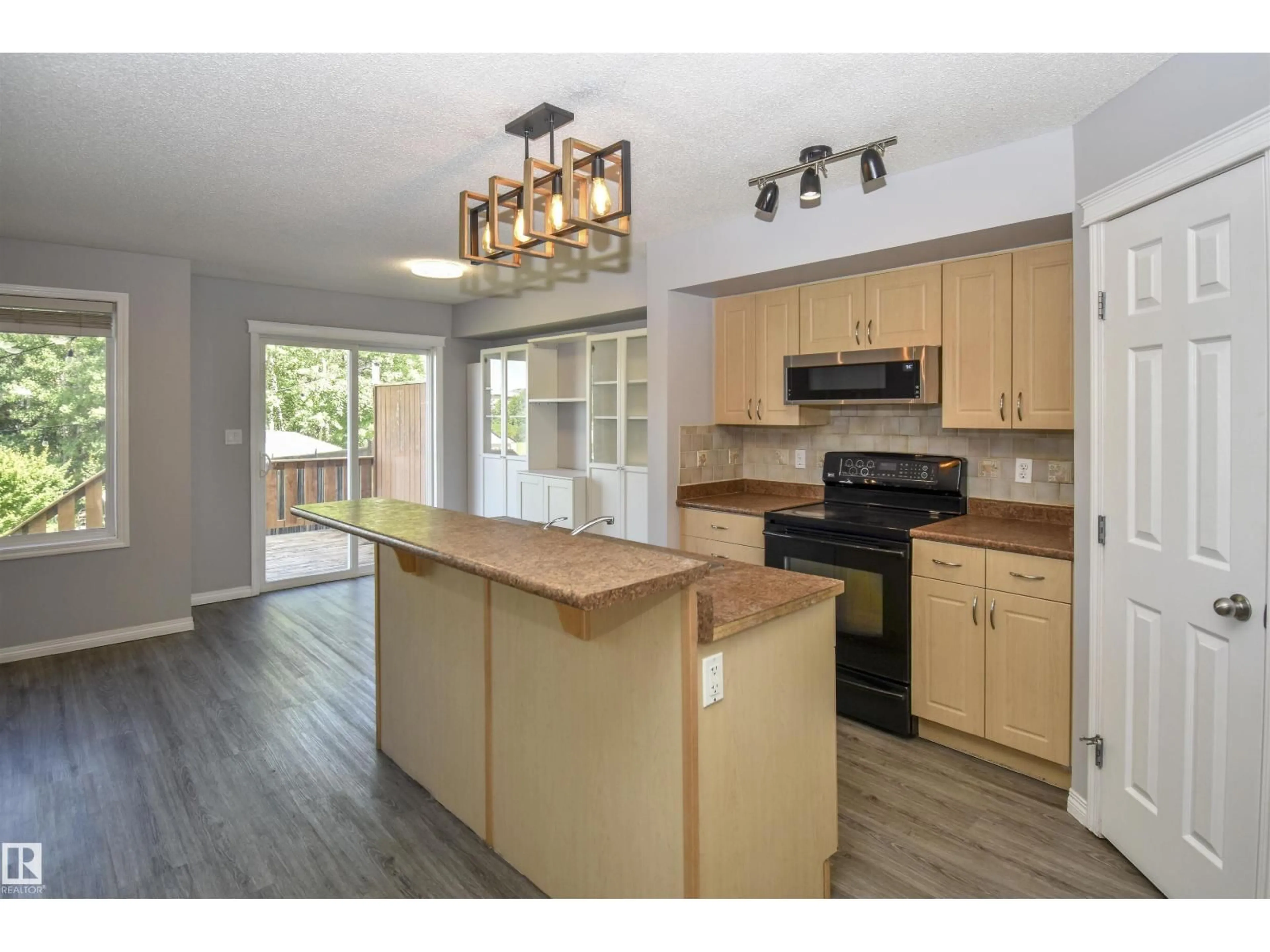Open concept kitchen, wood/laminate floor for 72 HARTWICK LD, Spruce Grove Alberta T7X0A5