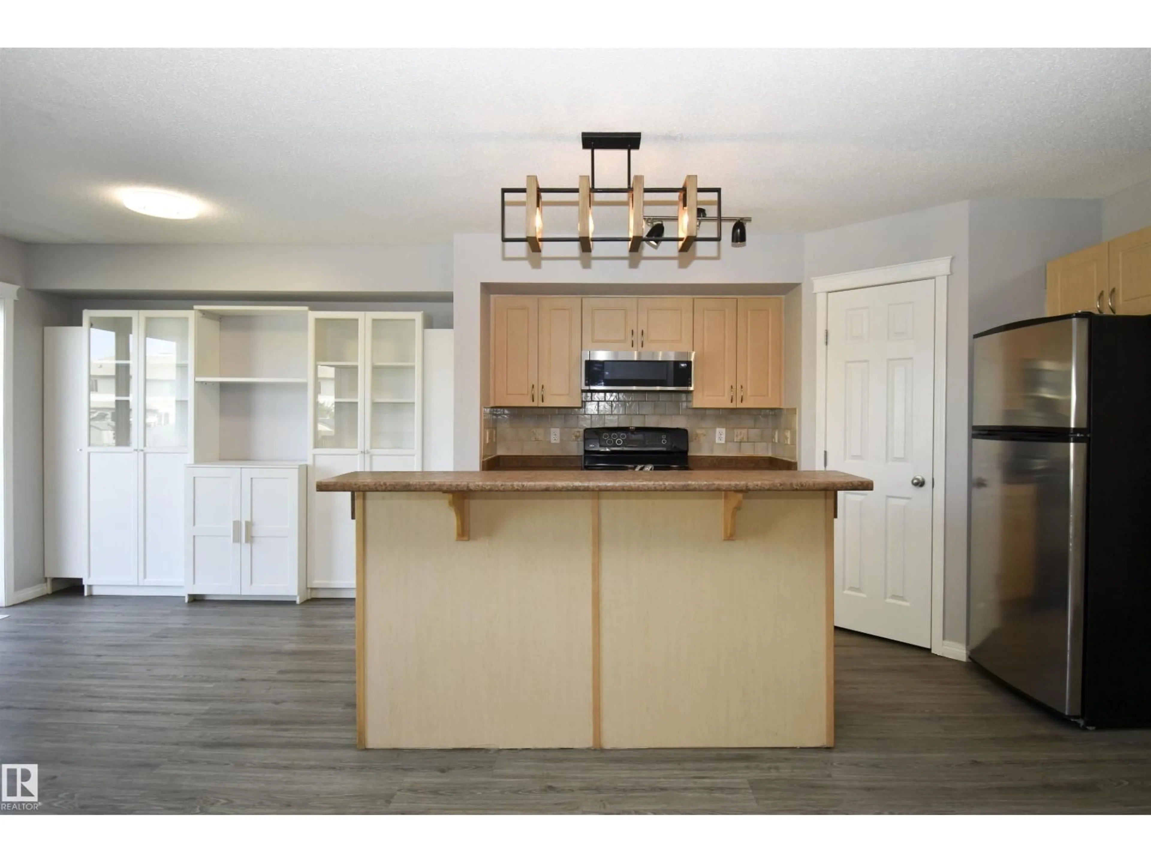 Open concept kitchen, wood/laminate floor for 72 HARTWICK LD, Spruce Grove Alberta T7X0A5