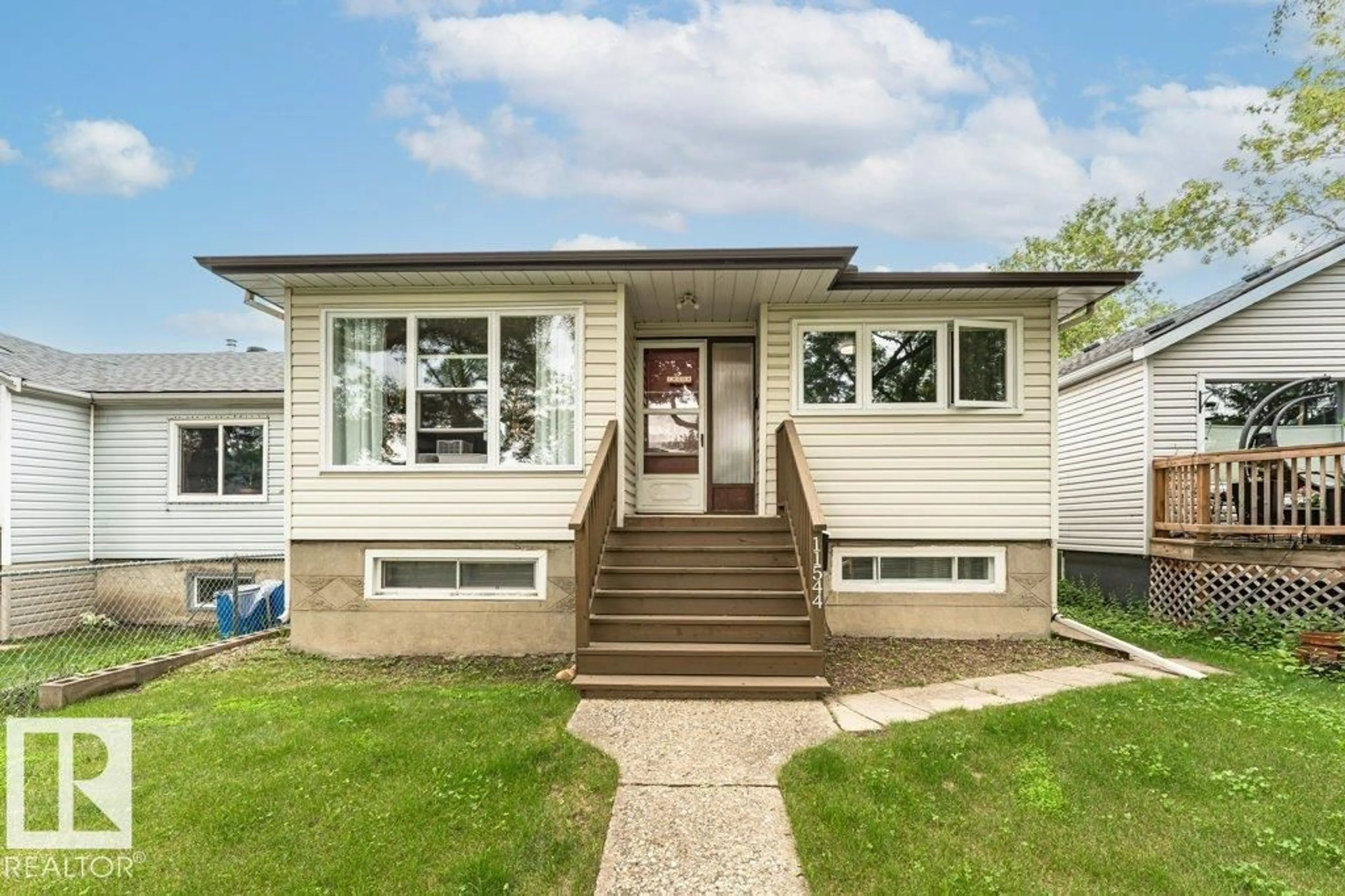 Home with vinyl exterior material, street for 11544 71 ST, Edmonton Alberta T5B1V9