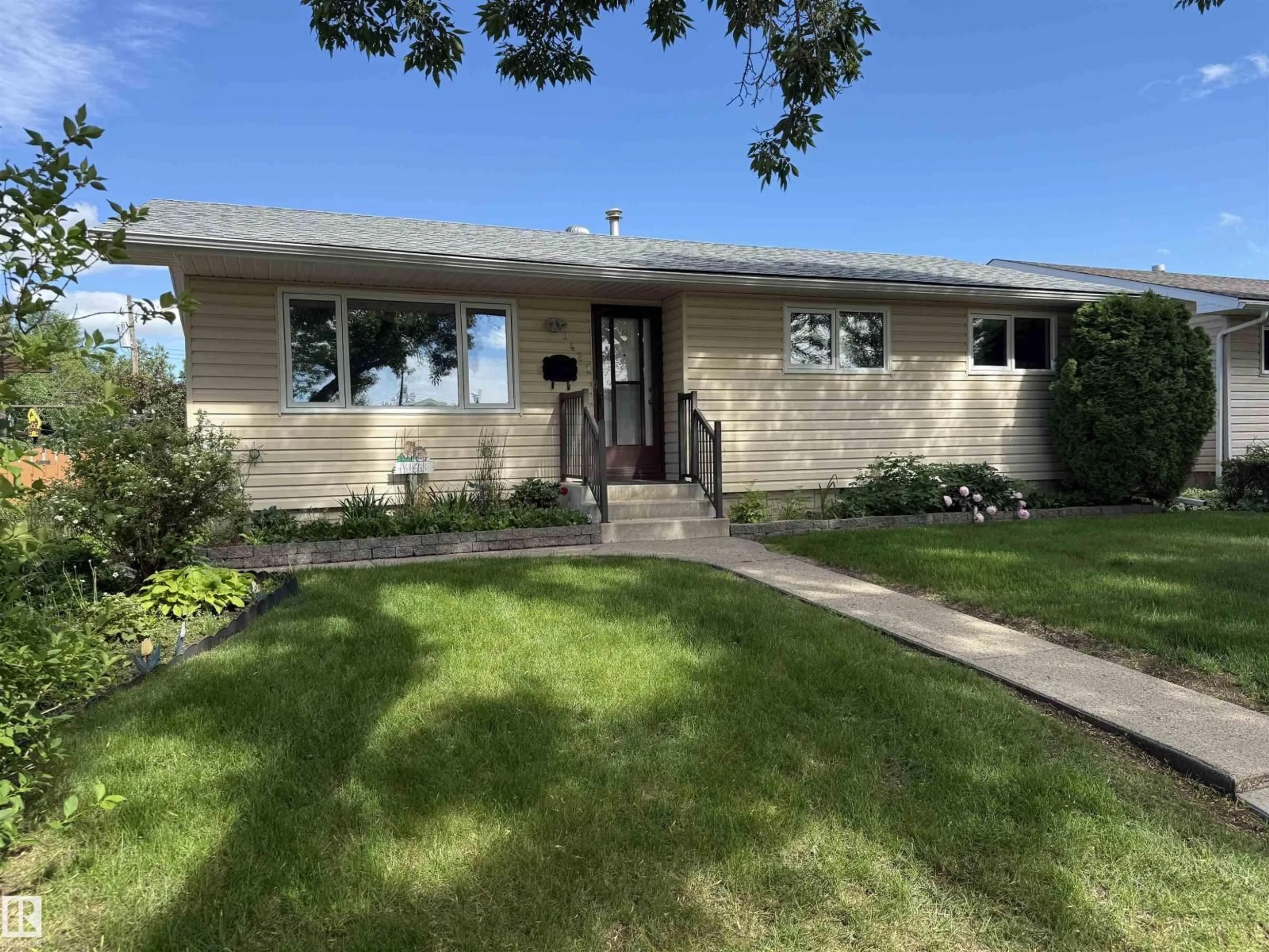 Home with vinyl exterior material, street for 9421 97 ST, Fort Saskatchewan Alberta T8L1S9