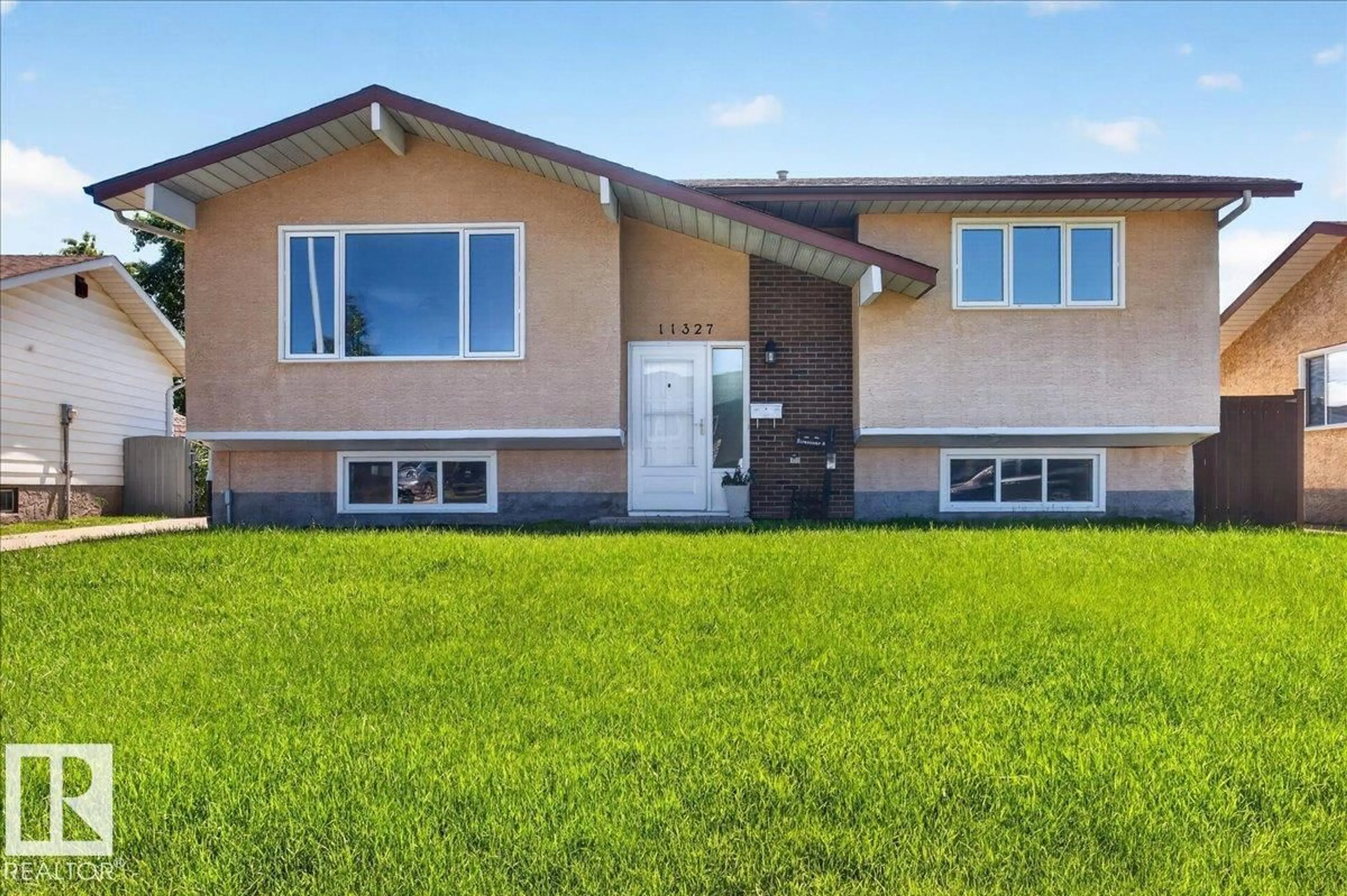 Home with vinyl exterior material, street for 11327 165 AV, Edmonton Alberta T5X3V8